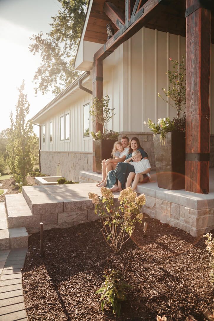 Outdoor family photography session with parents and children during golden hour in Omaha, Nebraska