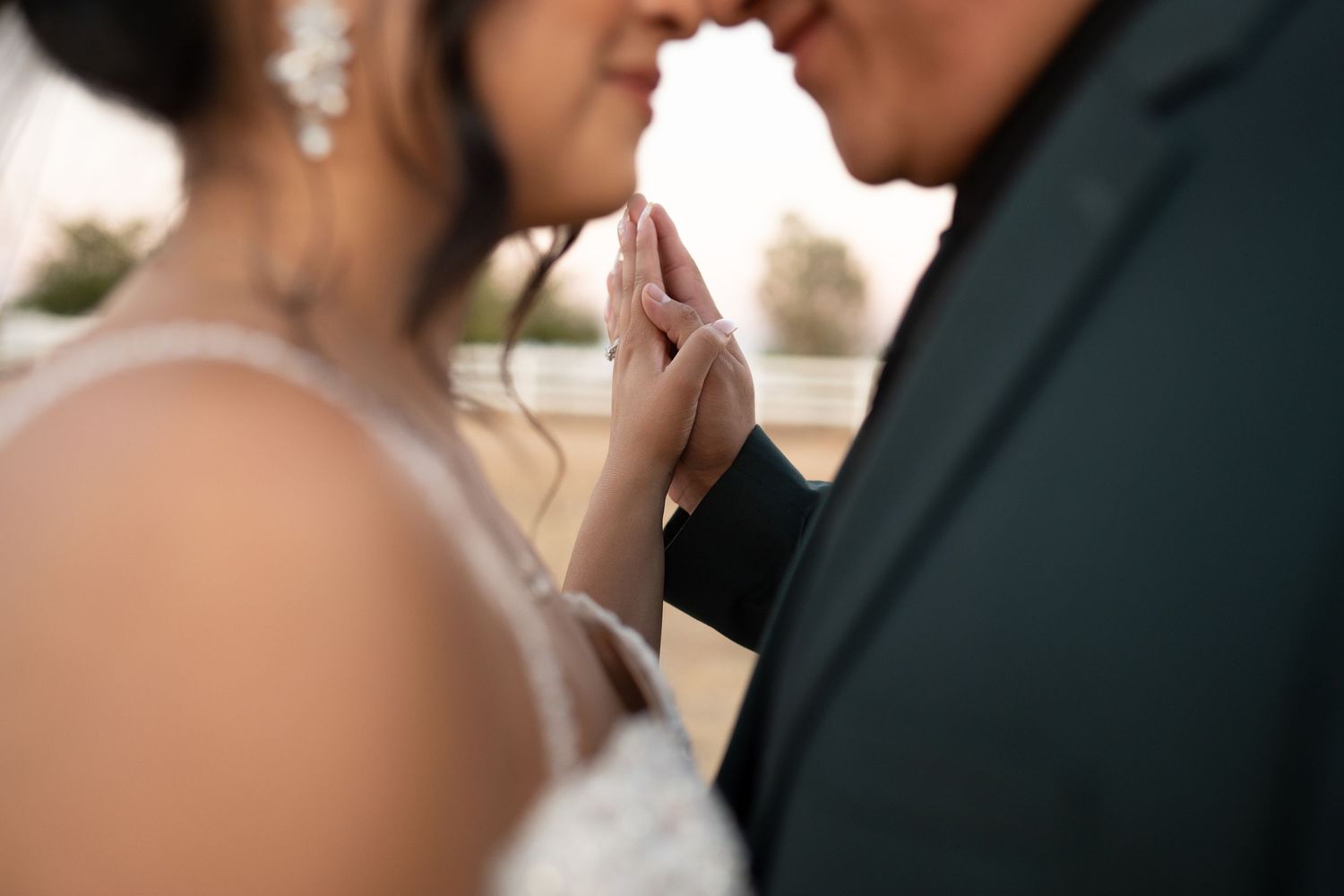 Close-up wedding detail shots showing rings, invitations, and bridal accessories.