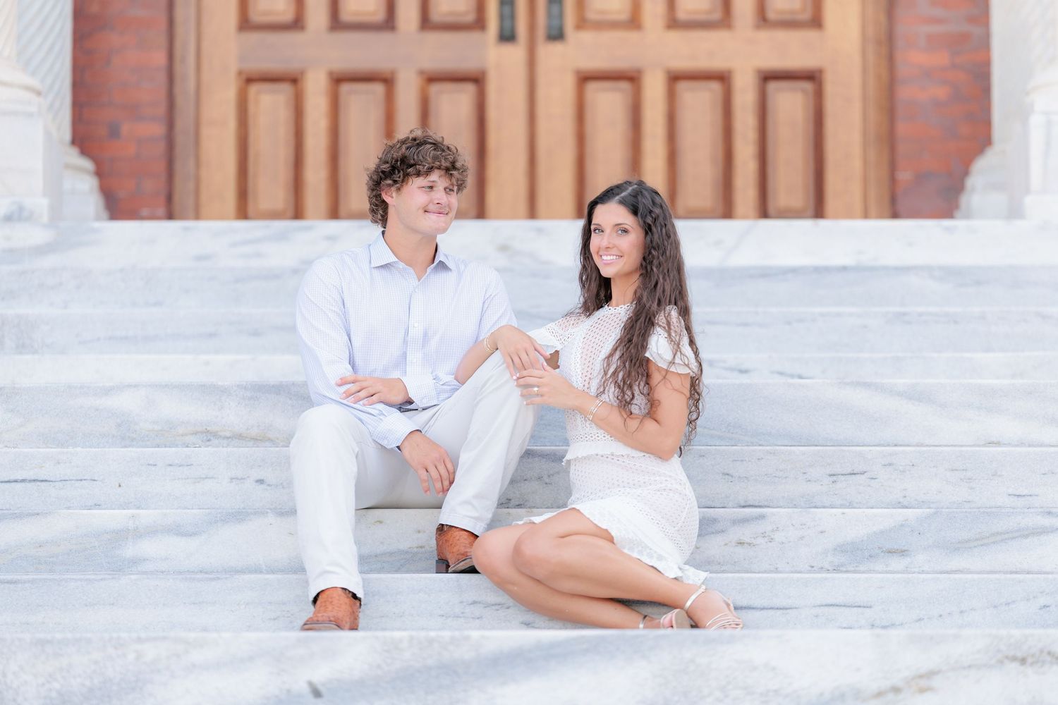 Authentic, joyful engagement portrait of a couple laughing together during an engagement session with photographer based in Valdosta, GA.