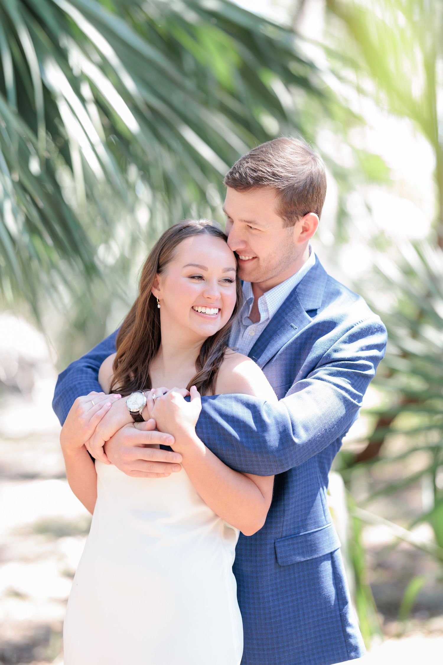 Authentic, joyful engagement portrait of a couple embracing during their engagement session with a photographer based in Valdosta, GA.