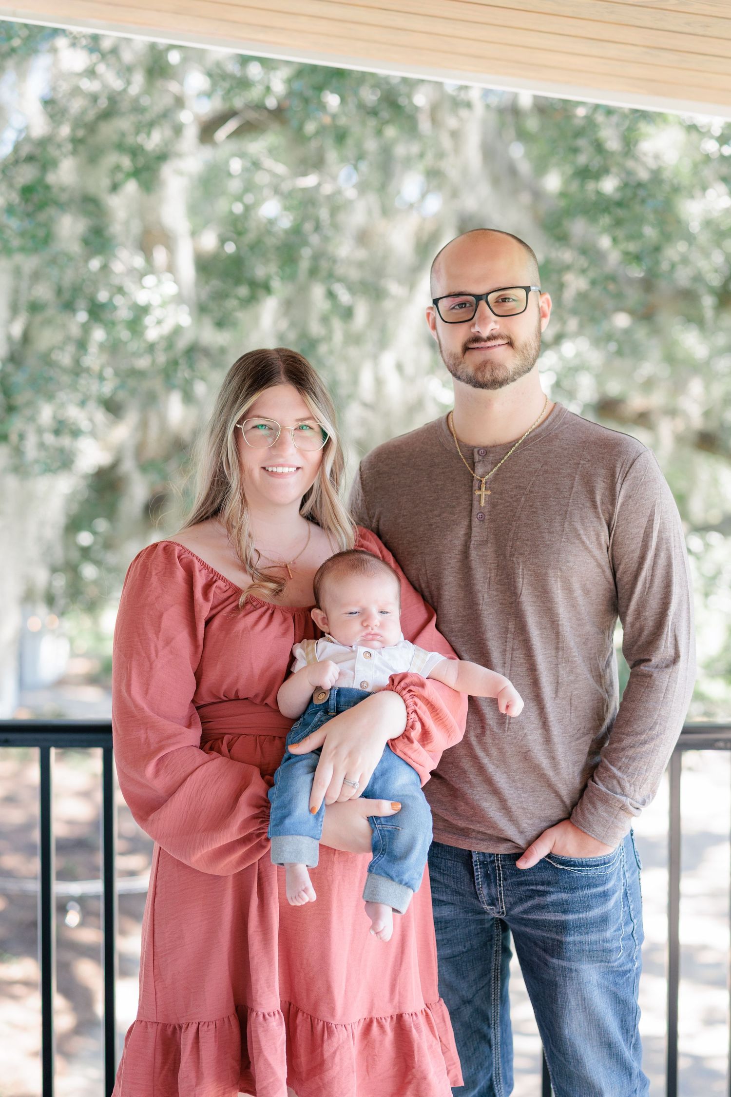 Candid, natural family portrait session featuring parents and children laughing together outdoors in South Georgia.