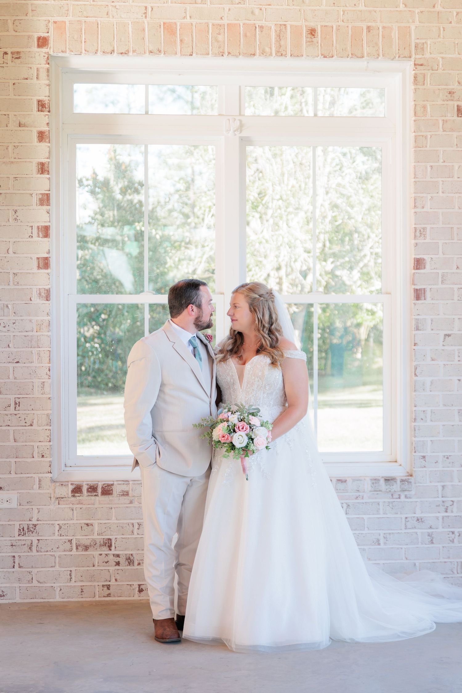 Portrait of a bride and groom embracing during a romantic couple's session during their wedding day in South Georgia.