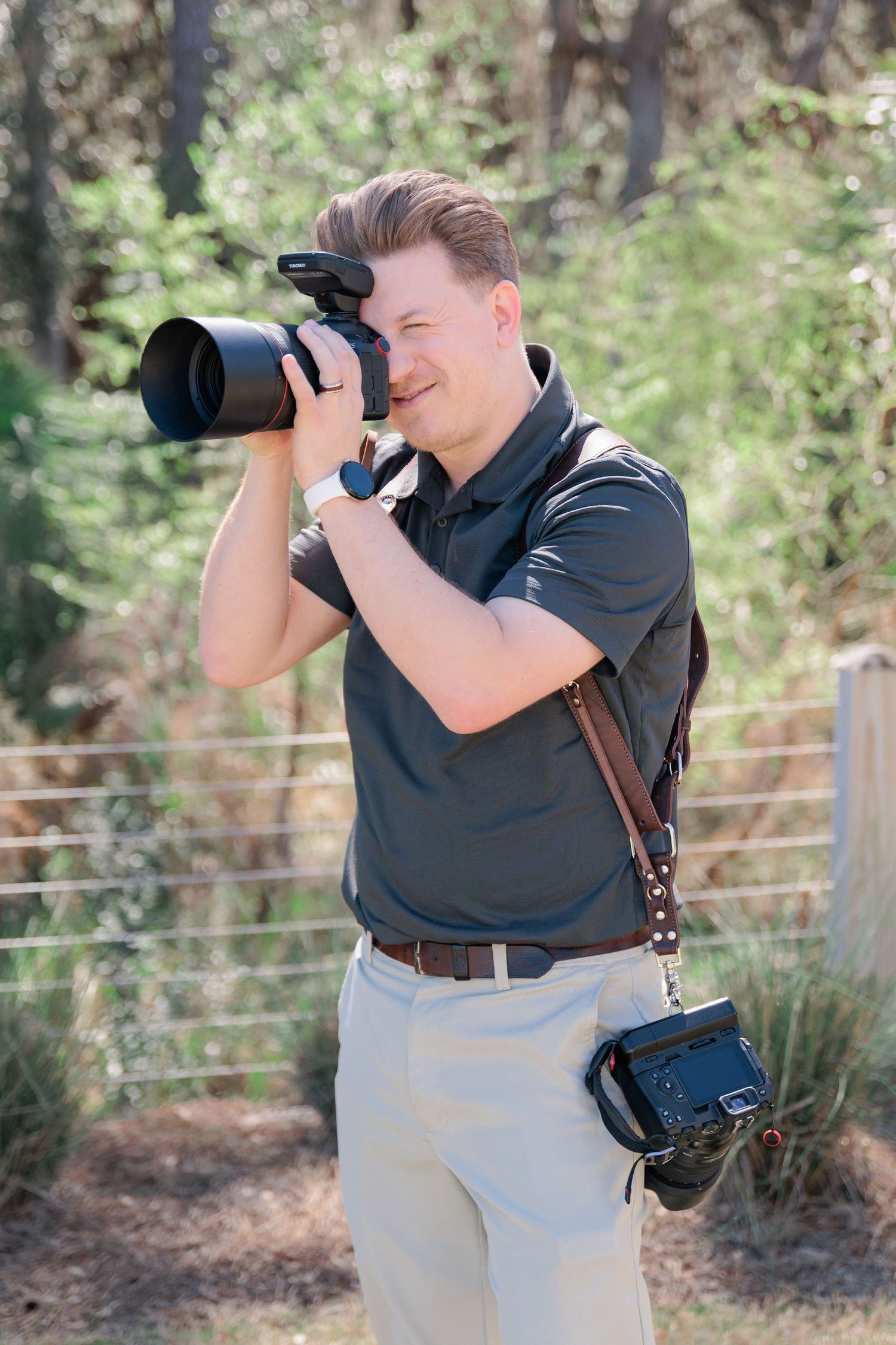 Portrait of Taylor Payne working at photographing a wedding. Photographer based out of Valdosta, Georgia. Services South Georgia.