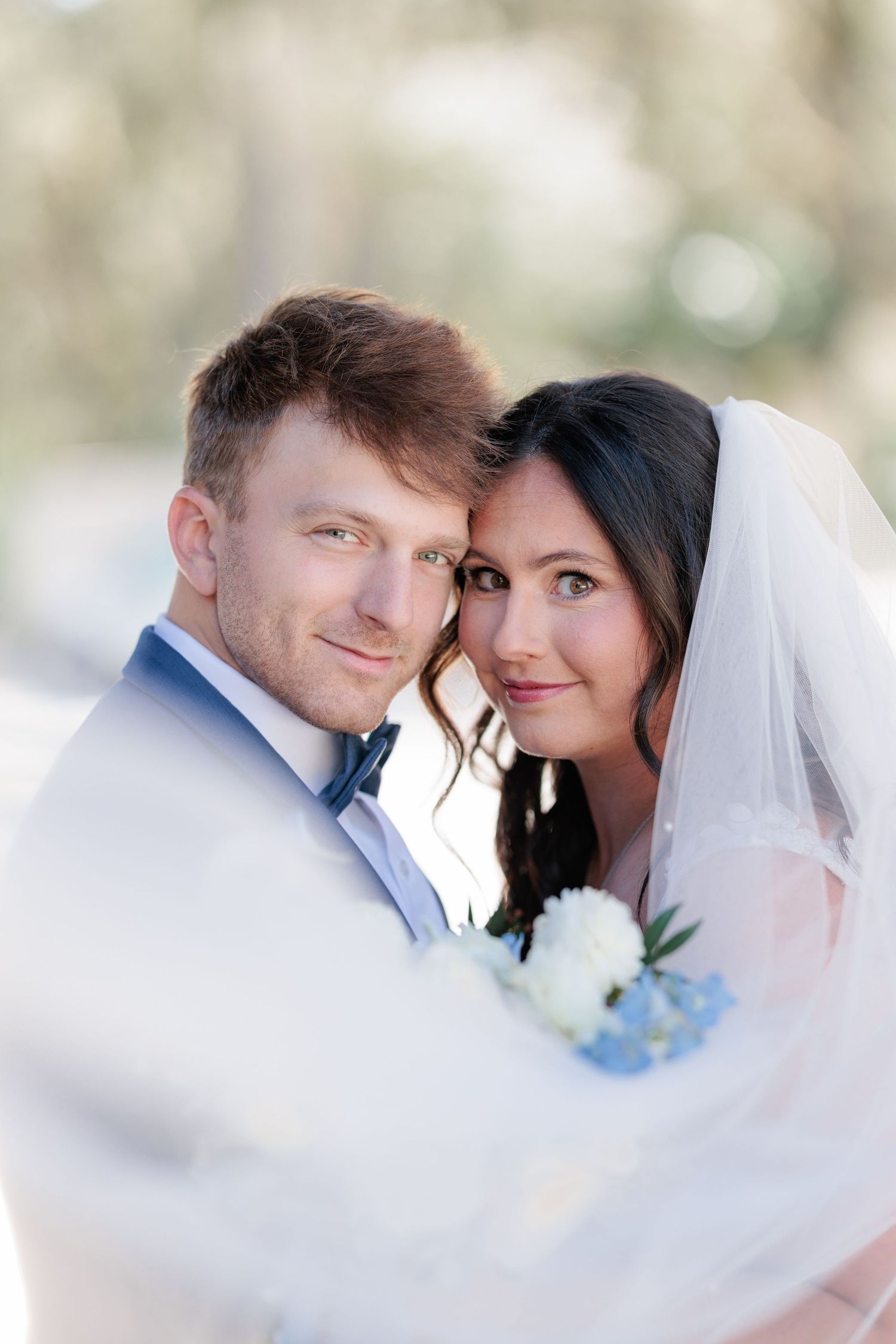 Portrait of a bride and groom embracing during a romantic couple's session during their wedding day in South Georgia.