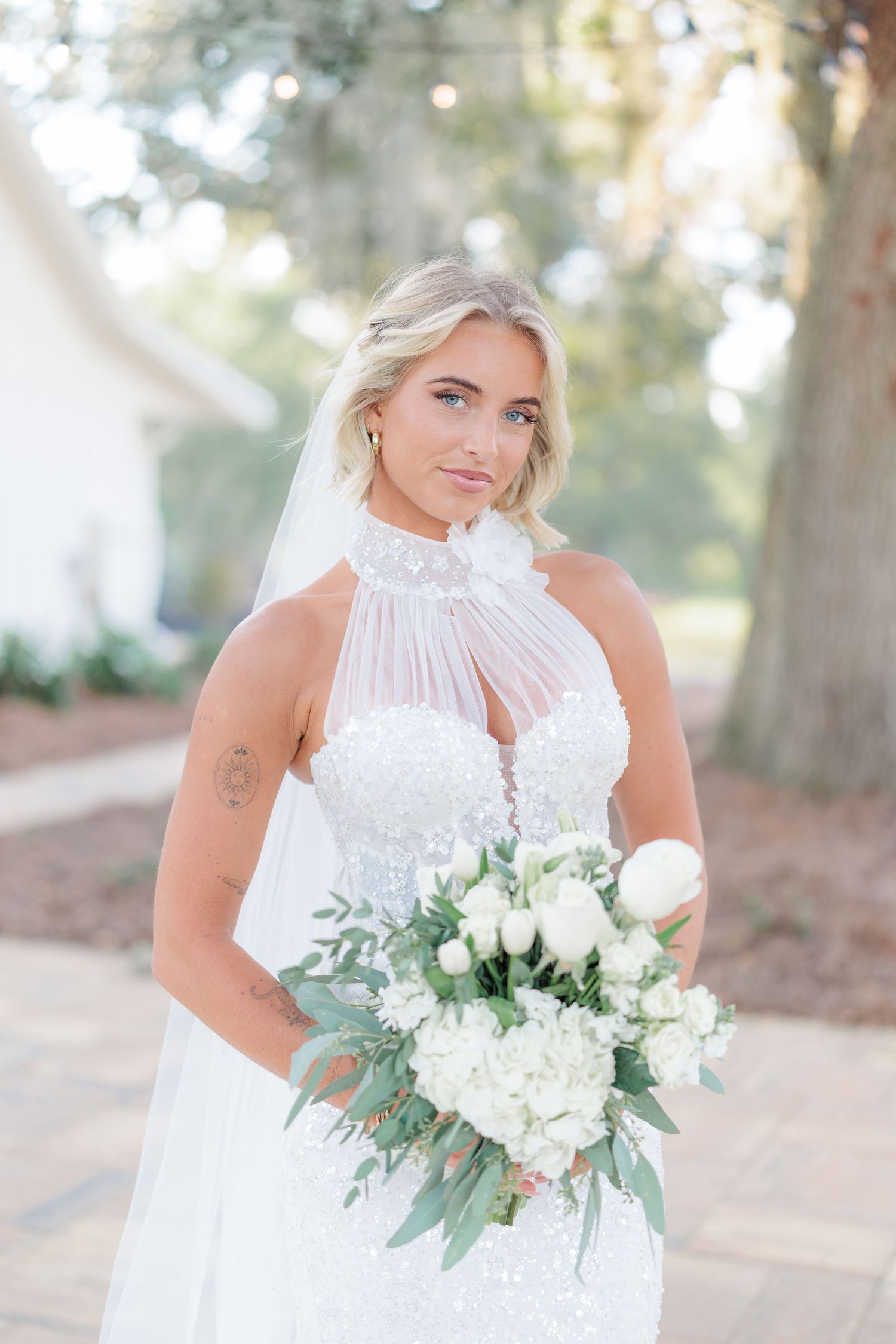 Elegant bridal portrait highlighting the bridal details of the wedding dress at a beautiful with a photographer based in South Georgia.