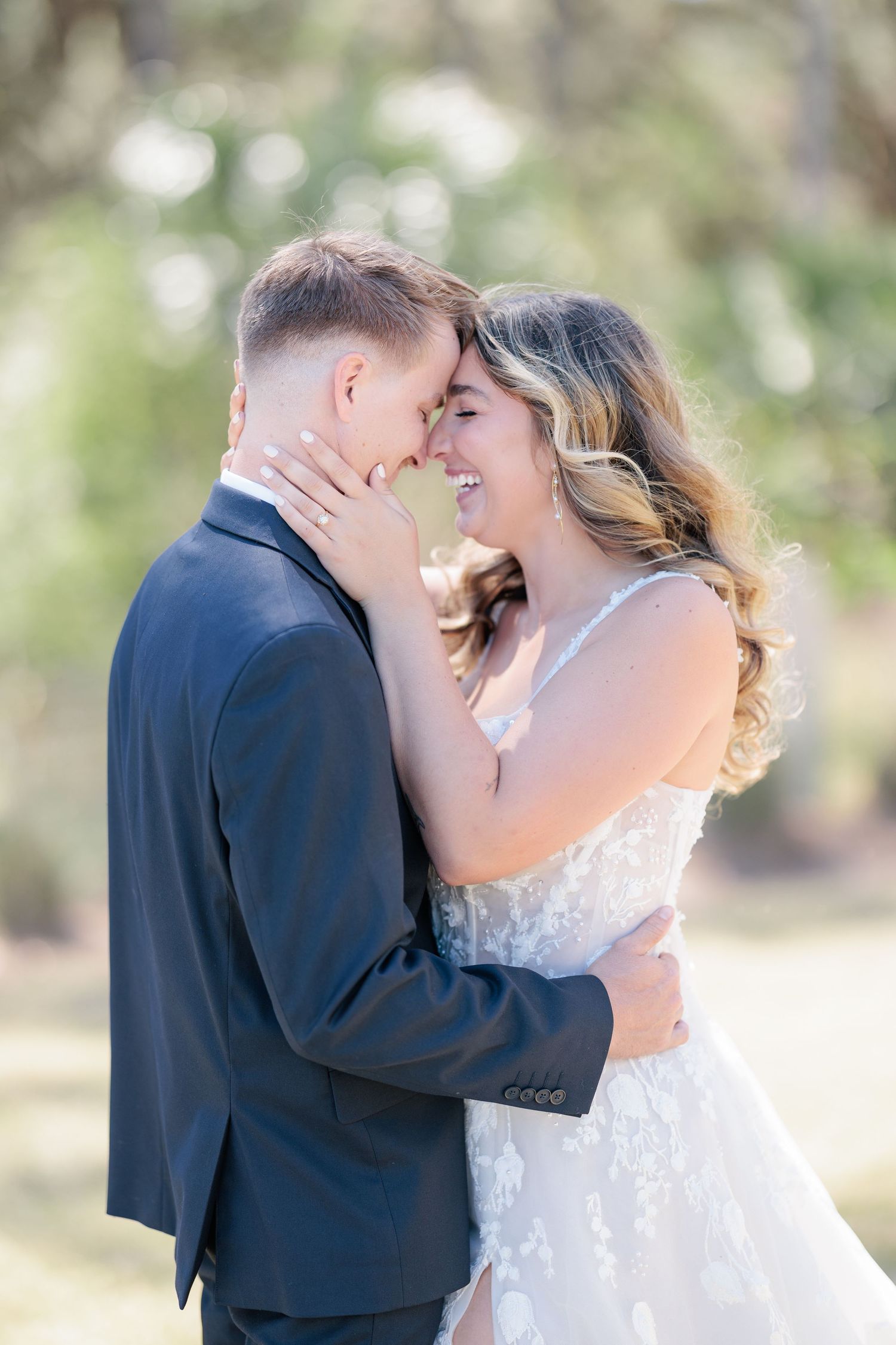 Candid portrait of a bride and groom embracing during a romantic sunset session at a Forbes Farm in South Georgia.
