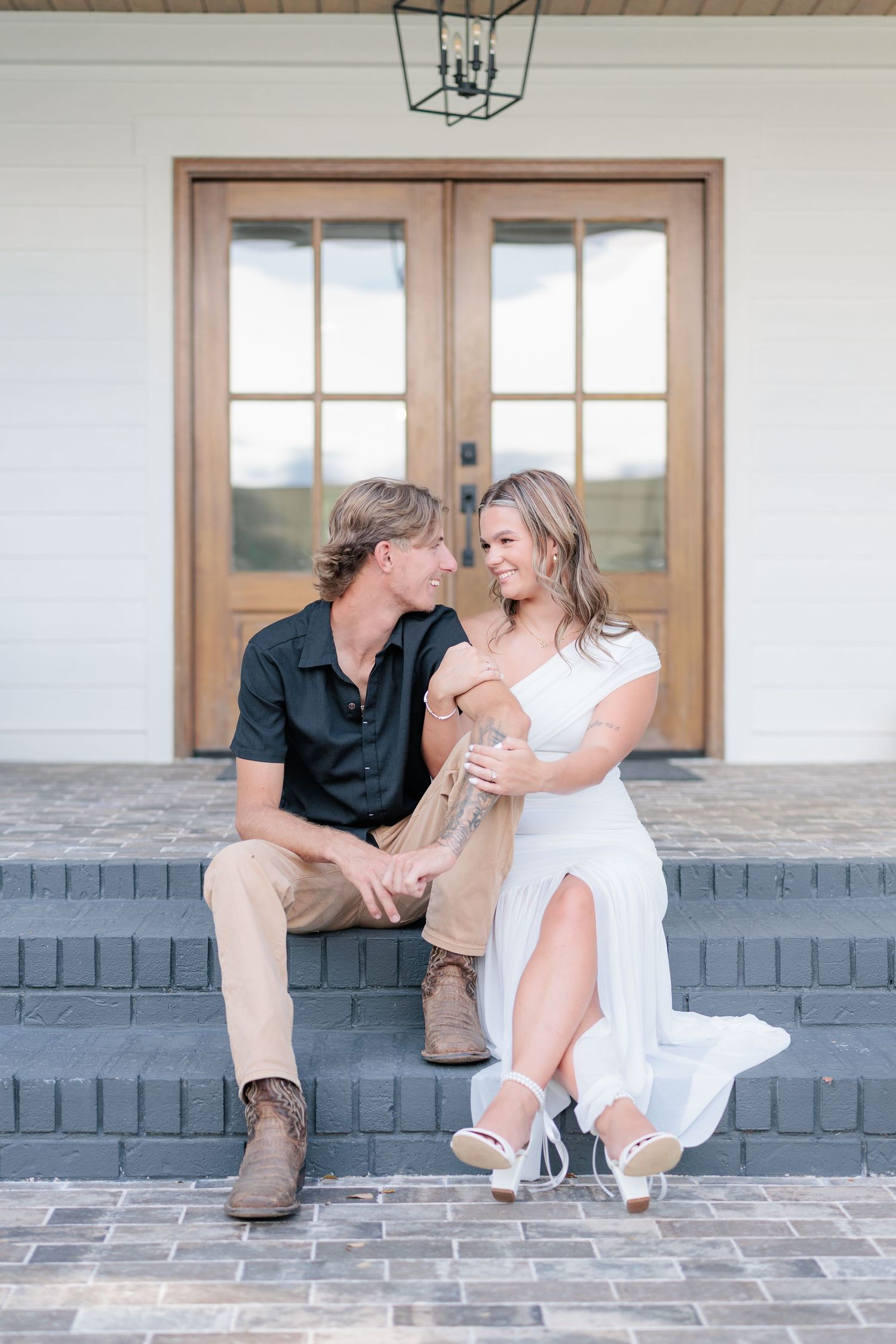 Authentic, joyful engagement portrait of a couple embracing during their engagement session with a photographer based in Valdosta, GA.