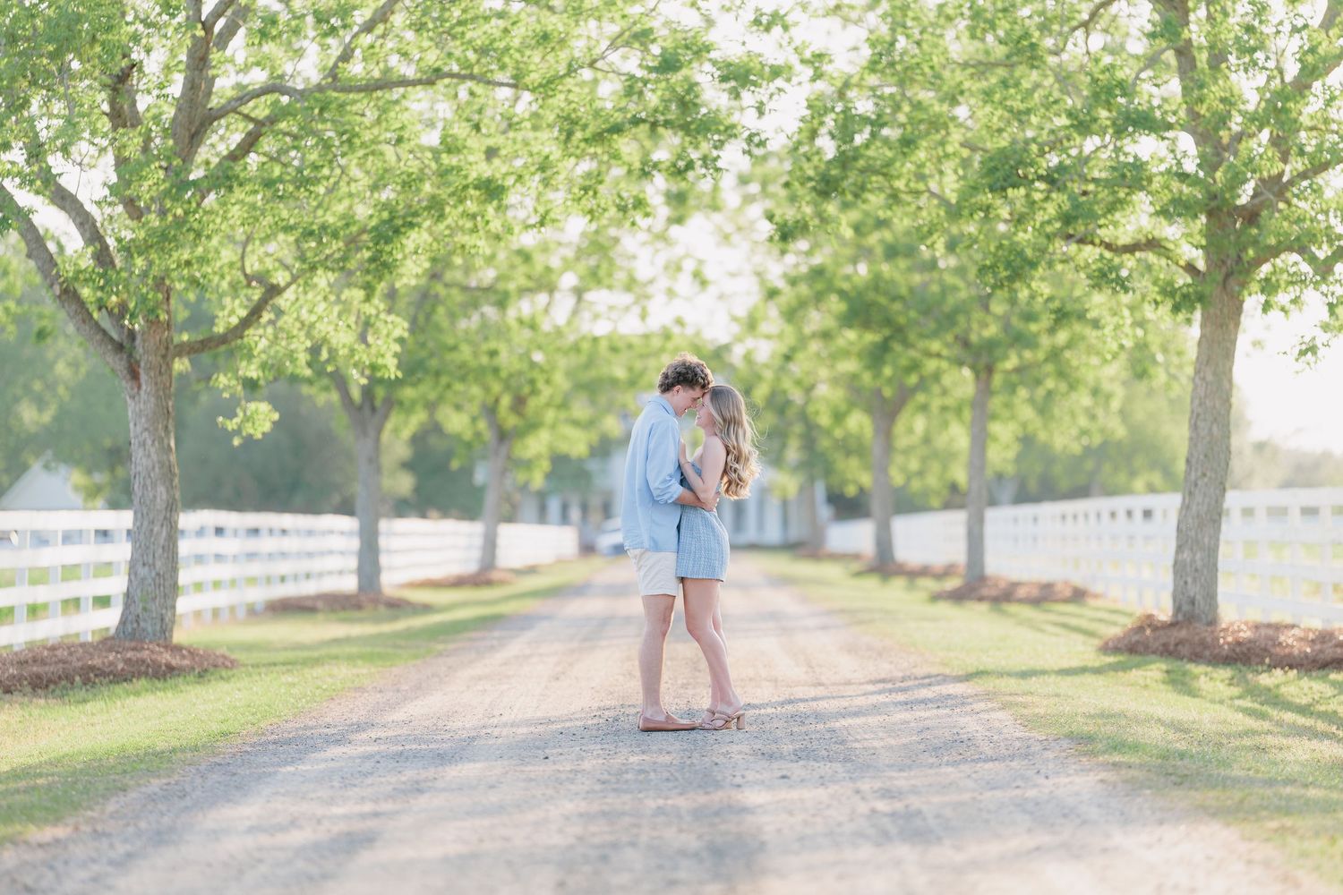 Authentic, joyful engagement portrait of a couple laughing together during a golden hour session with photographer based in Valdosta, GA.
