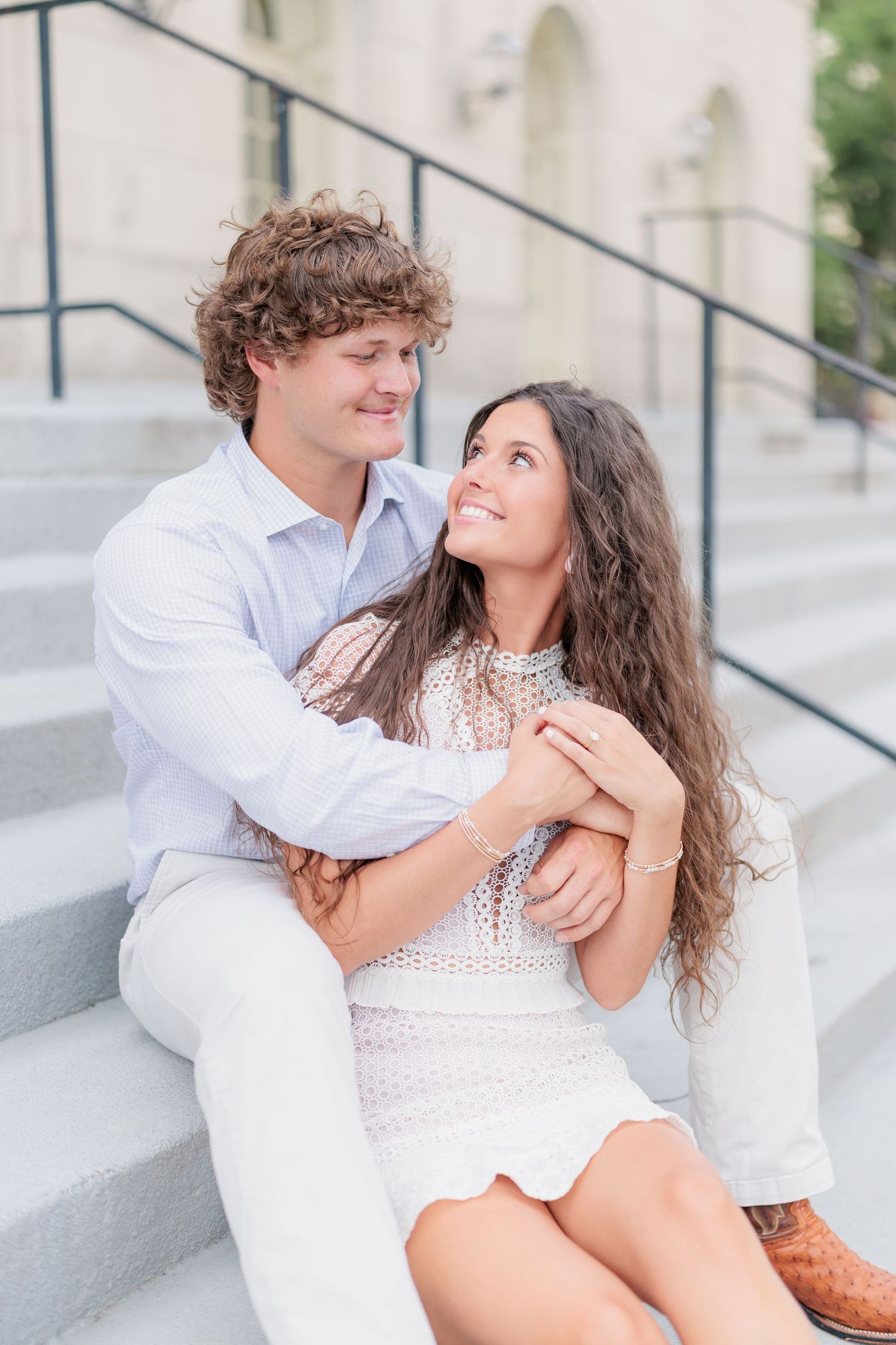 Authentic, joyful engagement portrait of a couple embracing during their engagement session with a photographer based in Valdosta, GA.