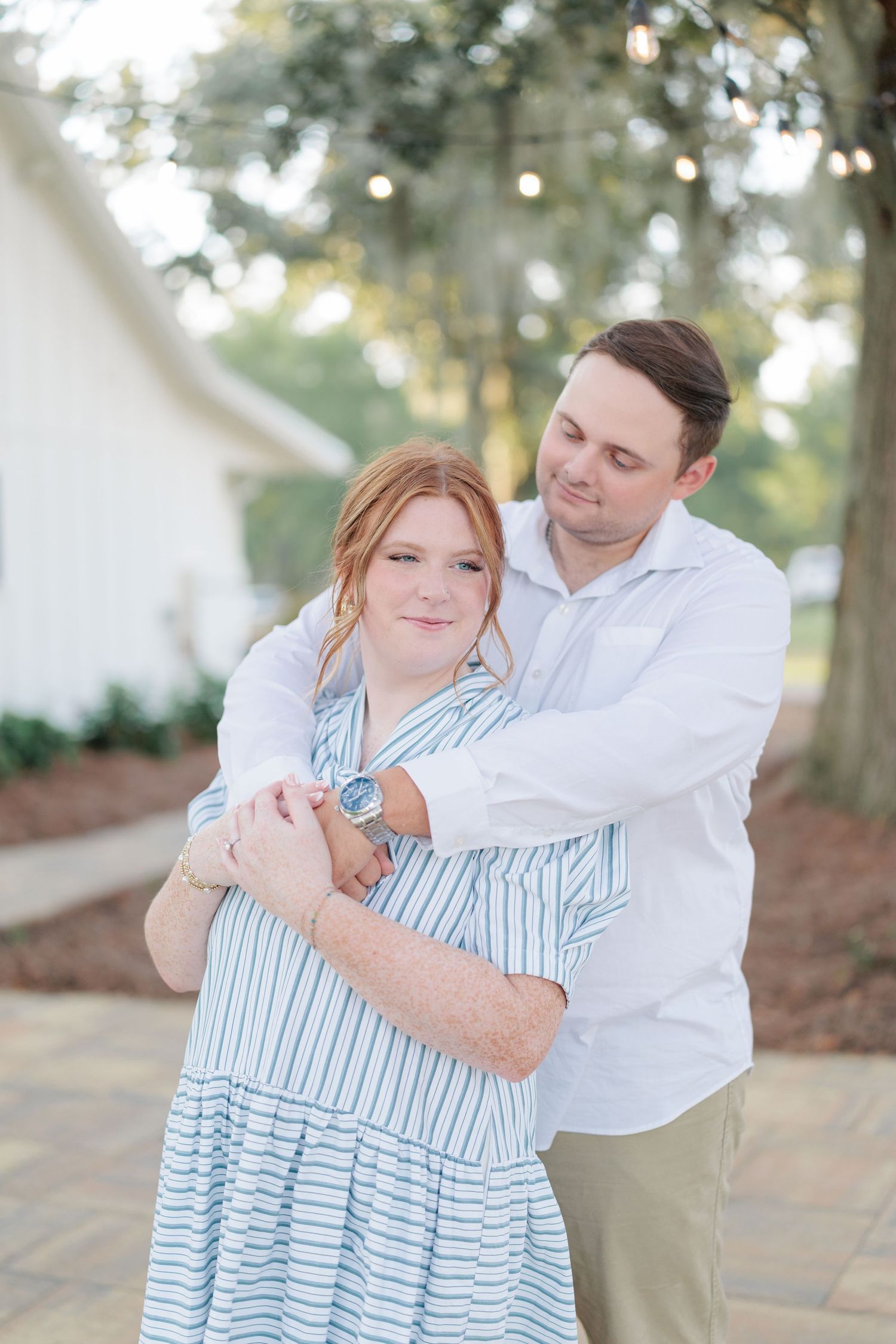 Authentic, joyful engagement portrait of a couple embracing during their engagement session with a photographer based in Valdosta, GA.