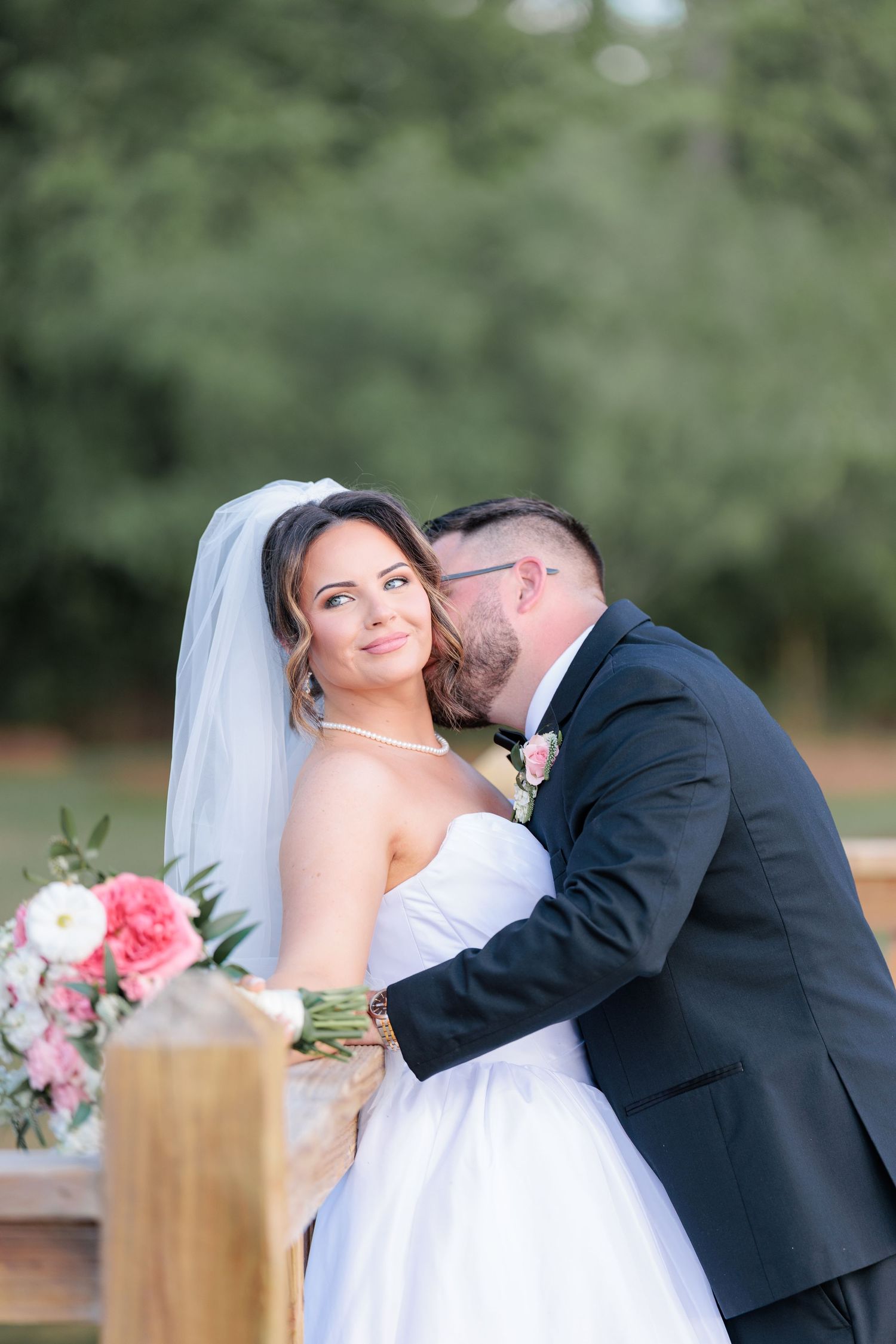 Portrait of a bride and groom embracing during a romantic couple's session during their wedding day in South Georgia.