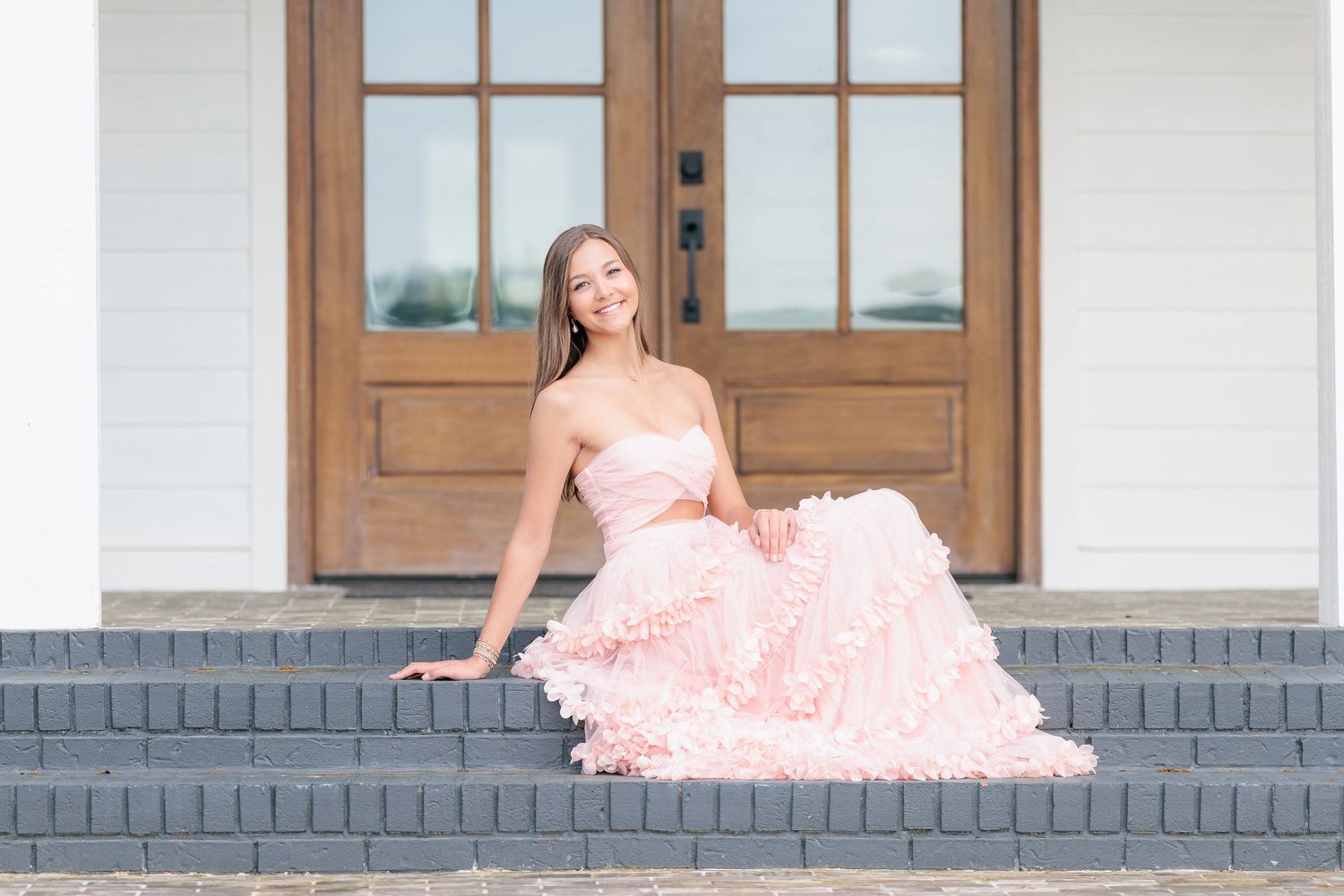 Elegant high school senior portrait of a girl in a beautiful dress at an outdoor park location in Valdosta, Georgia.