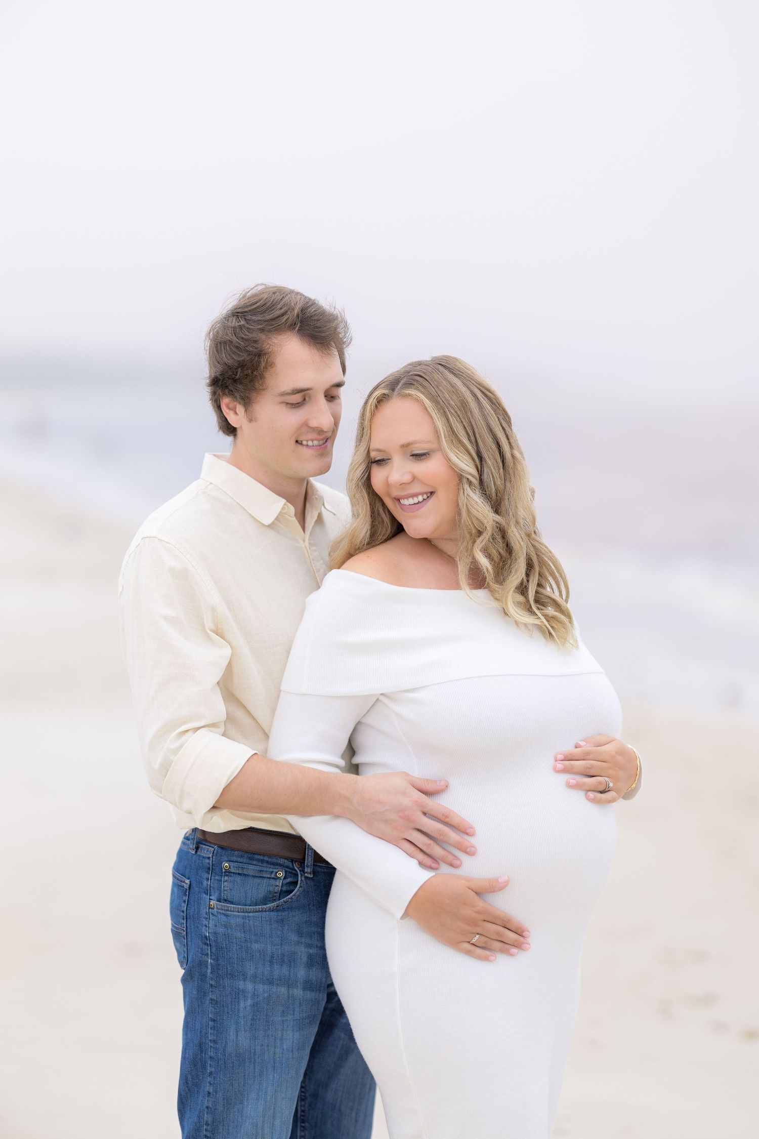 Image of couple celebrating their maternity journey and looking forward to meeting their little one with a photographer in South Georgia.