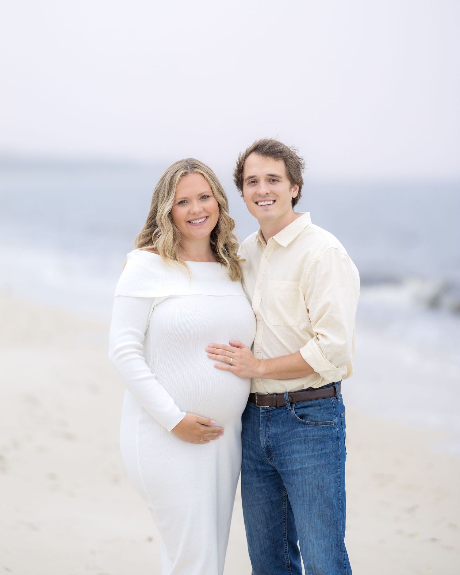 Image of couple celebrating their maternity journey and looking forward to meeting their little one with a photographer in South Georgia.