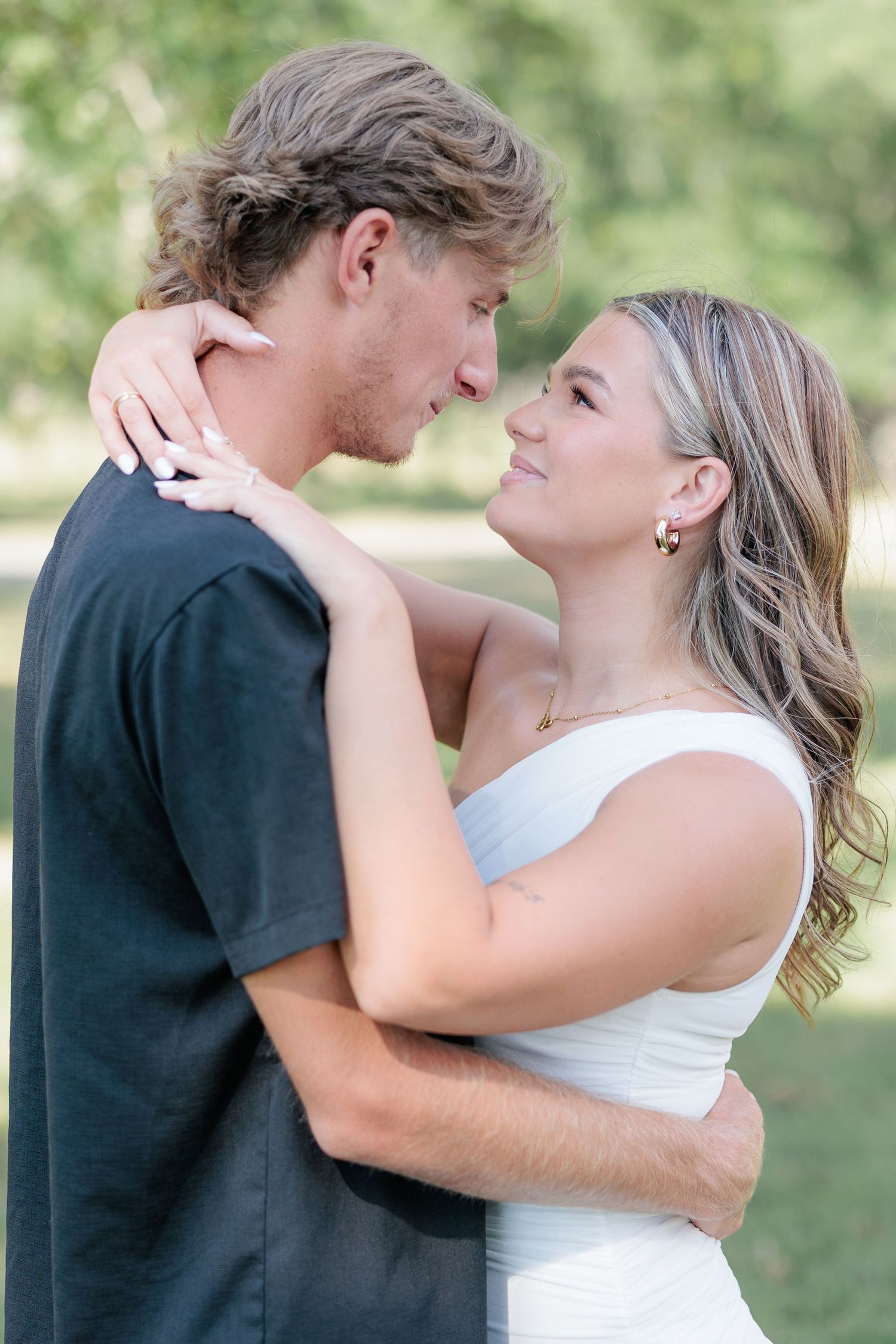 Authentic, joyful engagement portrait of a couple laughing together during an engagement session with photographer based in Valdosta, GA.