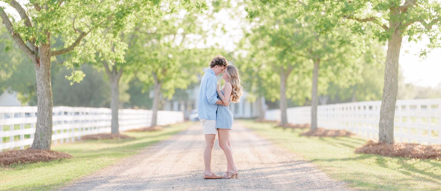 Authentic, joyful engagement portrait of a couple laughing together taken by a photographer based in South Georgia.