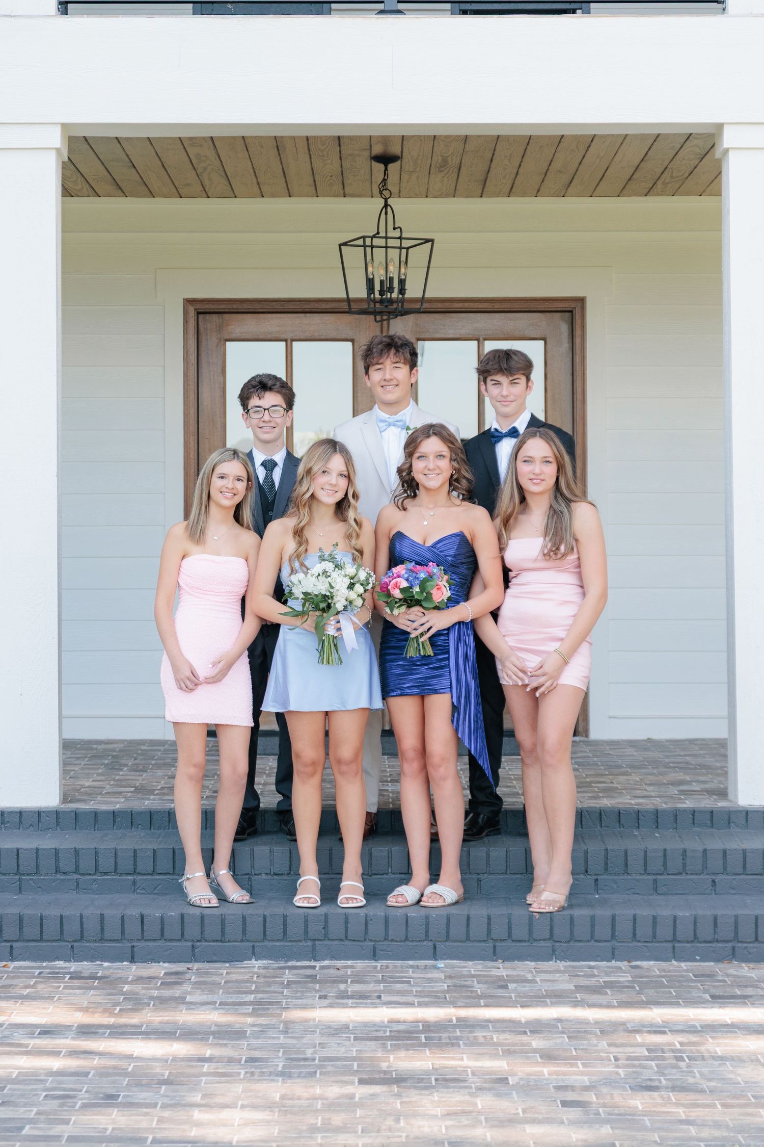 Fun and elegant portrait of a high school prom group dressed up in formalwear in the Valdosta South Georgia area.