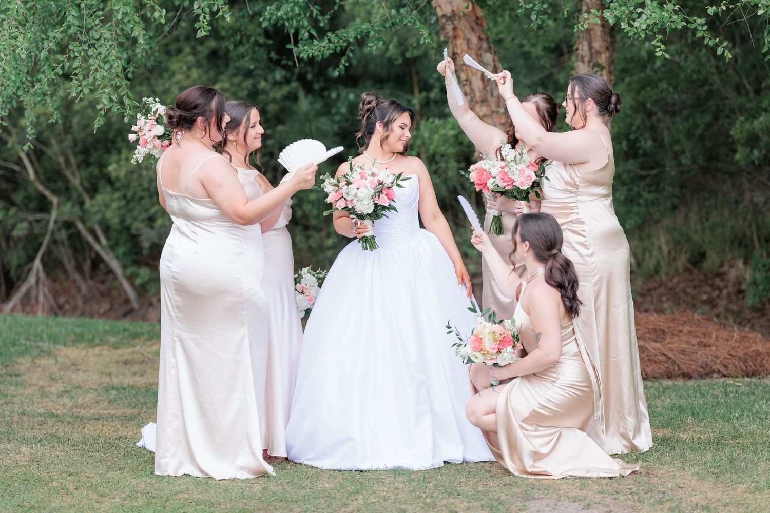 Fun, candid portrait of a bride and bridesmaids celebrating at a South Georgia wedding reception.