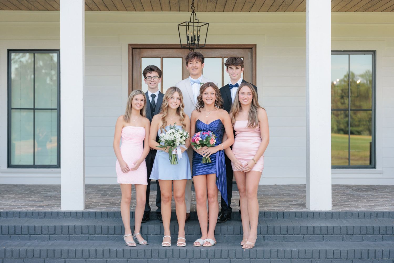 Fun and elegant portrait of a high school prom group dressed up in formalwear in the Valdosta South Georgia area.