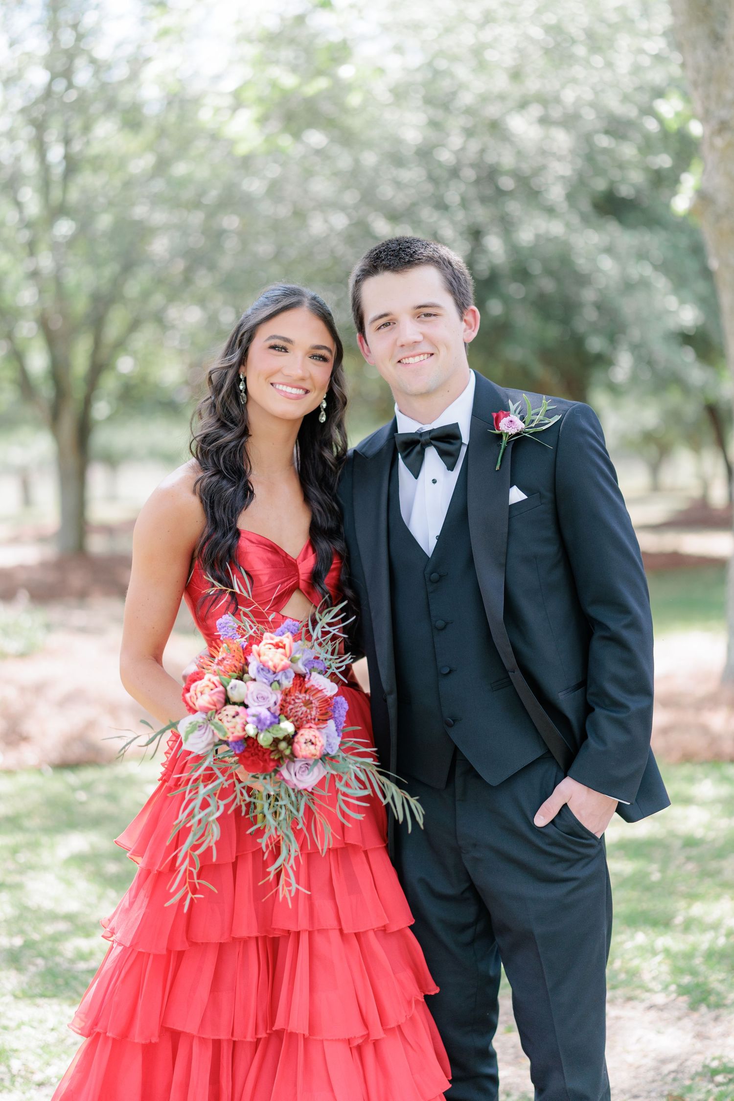 Elegant prom couple portrait of high school students dressed up in formalwear before the dance by a photographer based in Valdosta, GA.