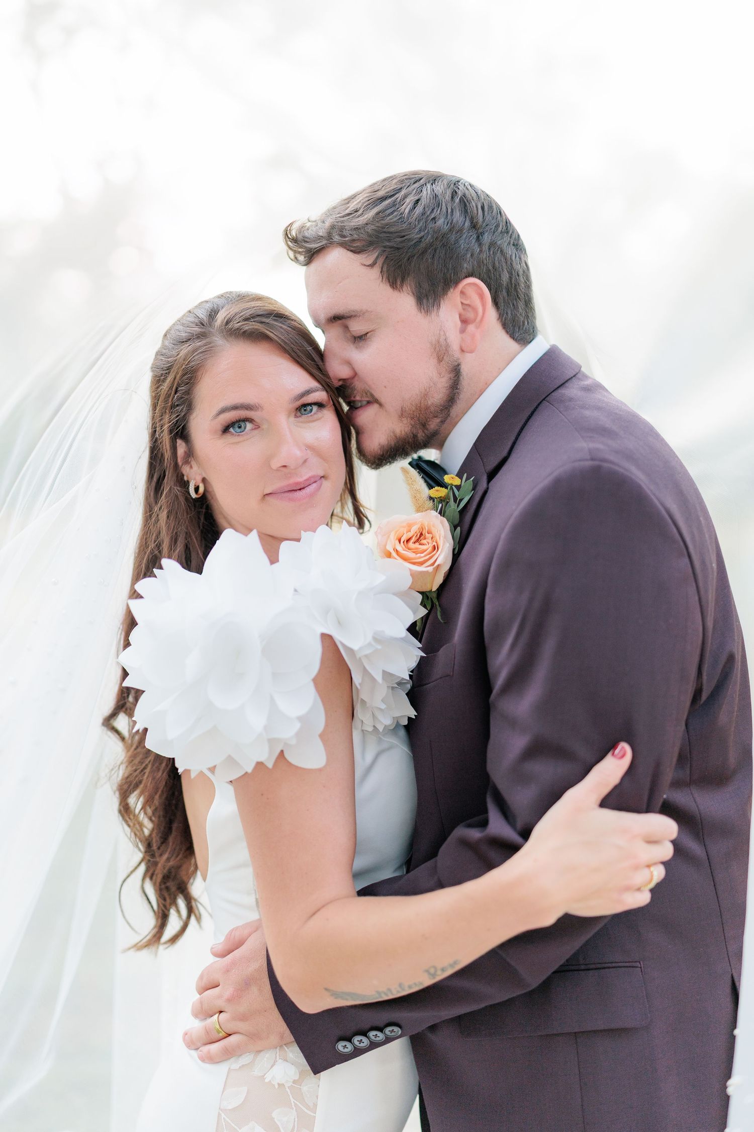 Portrait of a bride and groom embracing during a romantic couple's session during their wedding day in South Georgia.