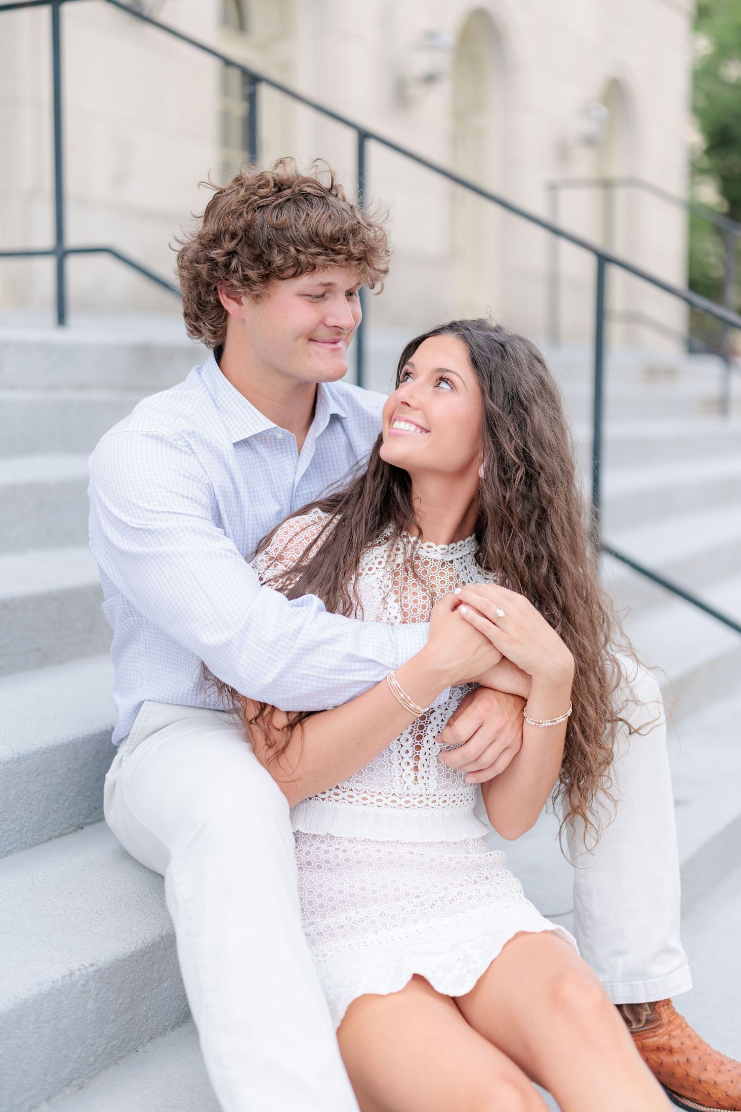 Authentic, joyful engagement portrait of a couple laughing together during a golden hour session in Macon, GA.