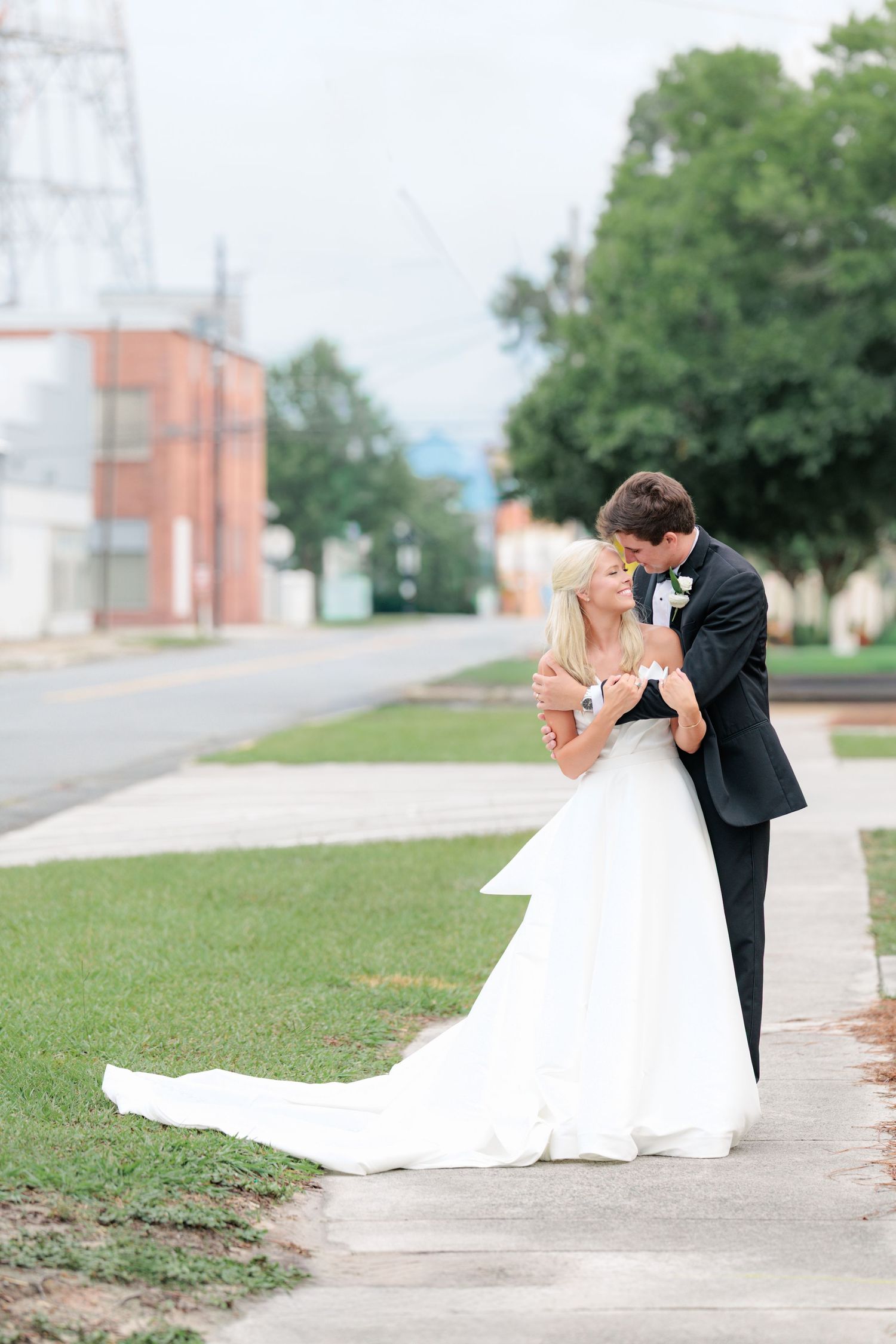 Couple enjoying themselves before entering their wedding reception in Waycross, Georgia. Taken by a photographer based in Valdosta, Georgia.