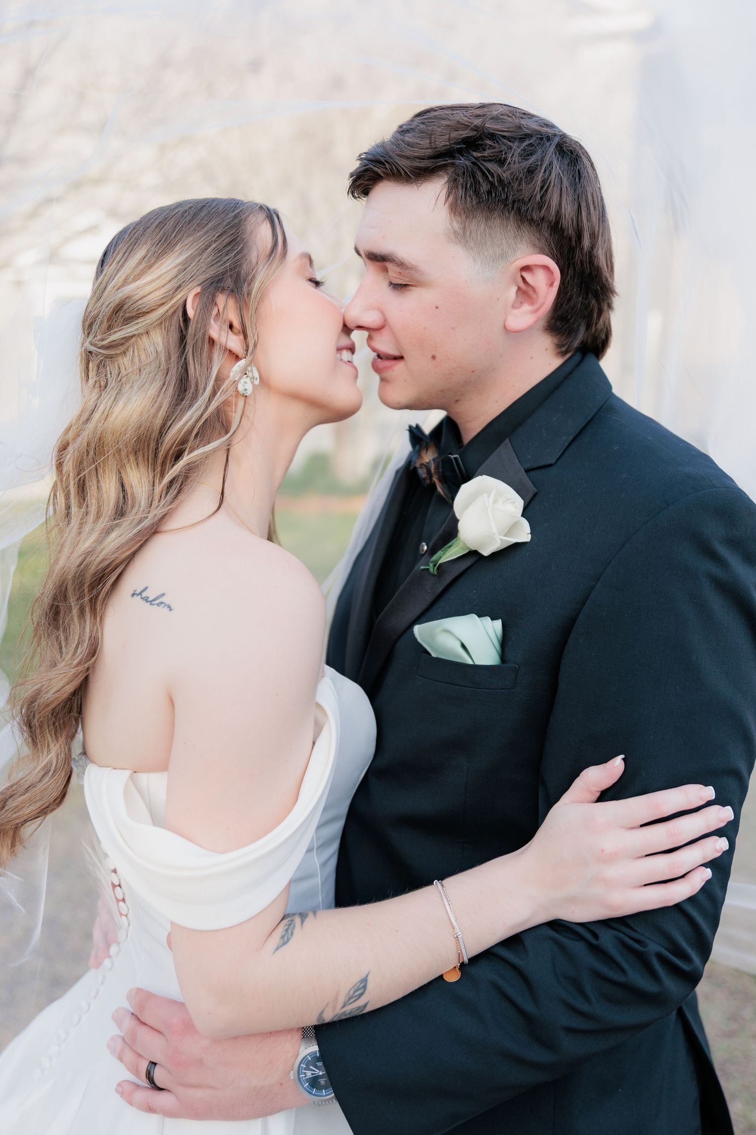 Portrait of a bride and groom embracing during a romantic couple's session during their wedding day in South Georgia.