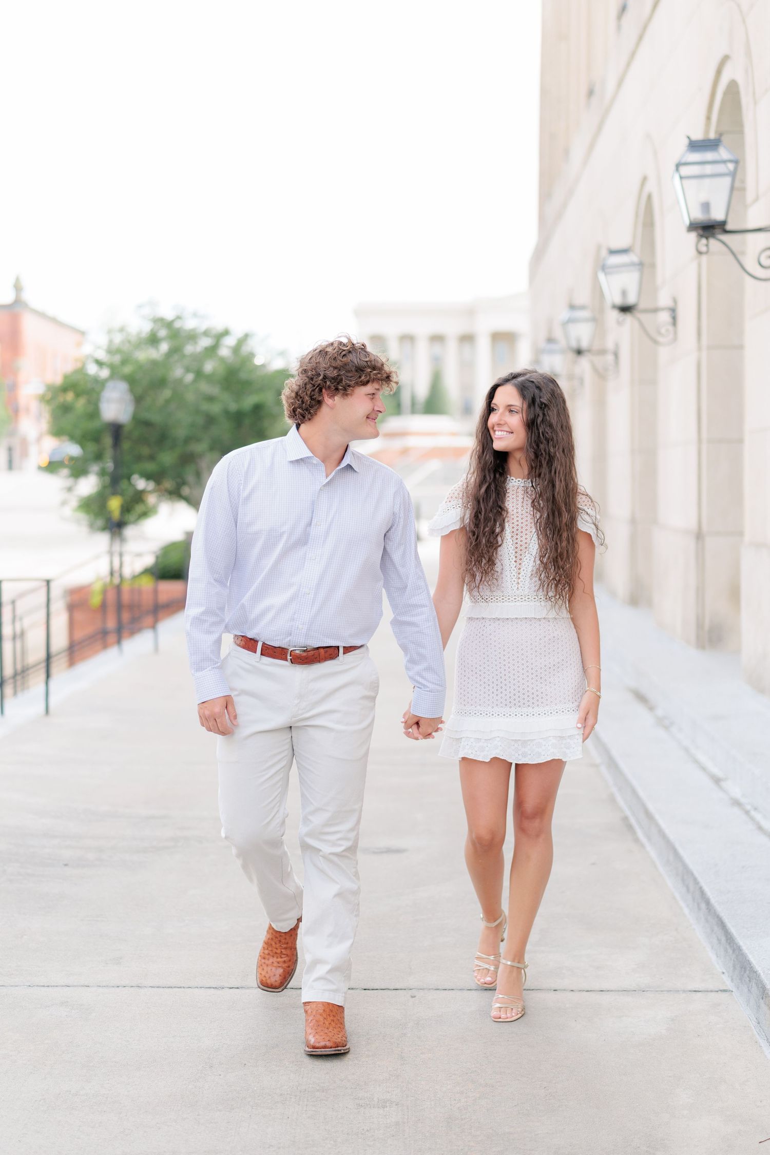 Authentic, joyful engagement portrait of a couple laughing together during an engagement session with photographer based in Valdosta, GA.
