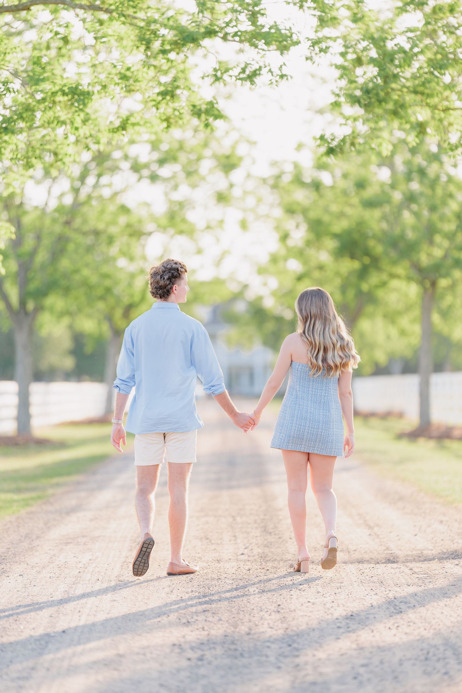Authentic, joyful engagement portrait of a couple laughing together during a golden hour session with photographer based in Valdosta, GA.