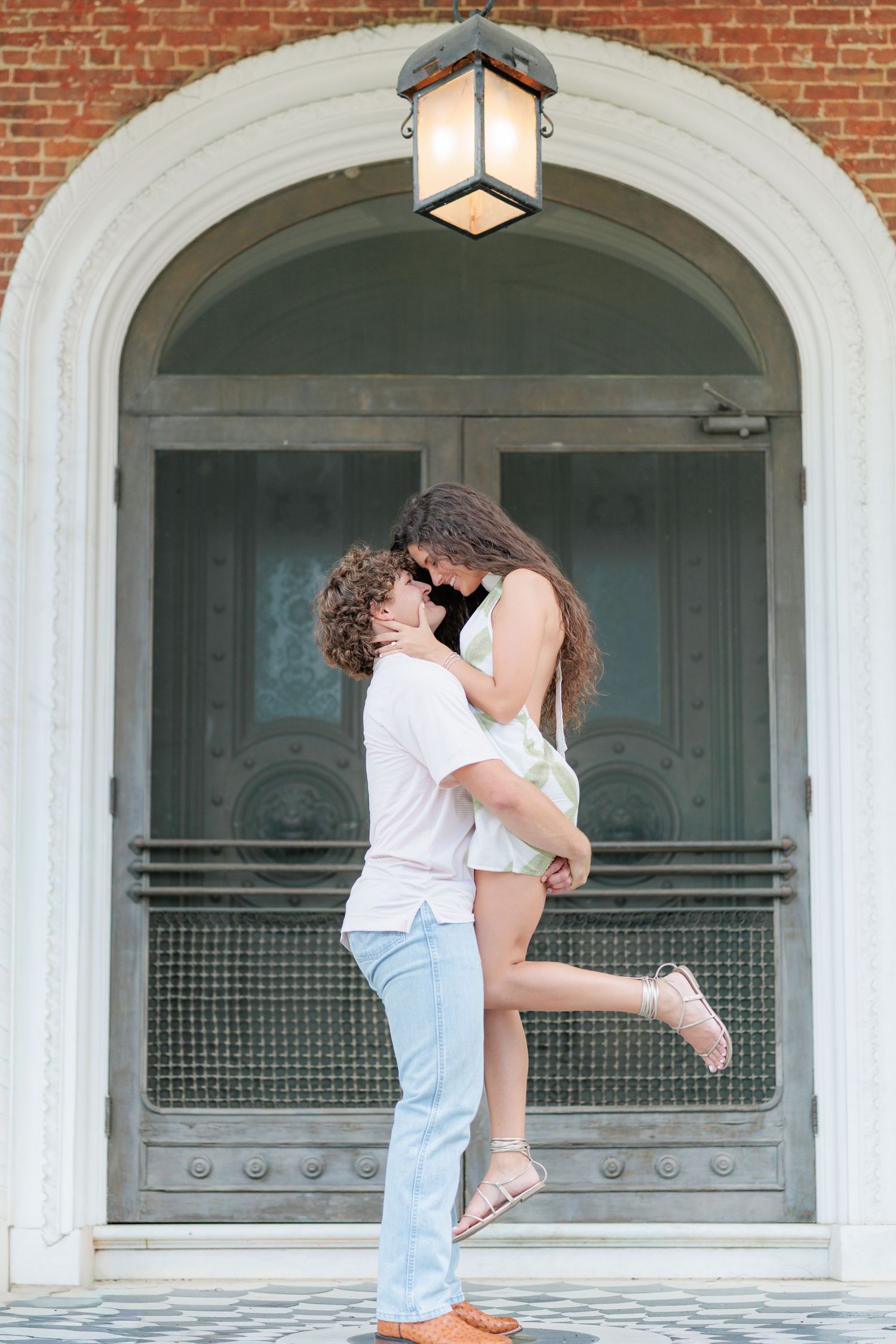 Authentic, joyful engagement portrait of a couple embracing during their engagement session with a photographer based in Valdosta, GA.