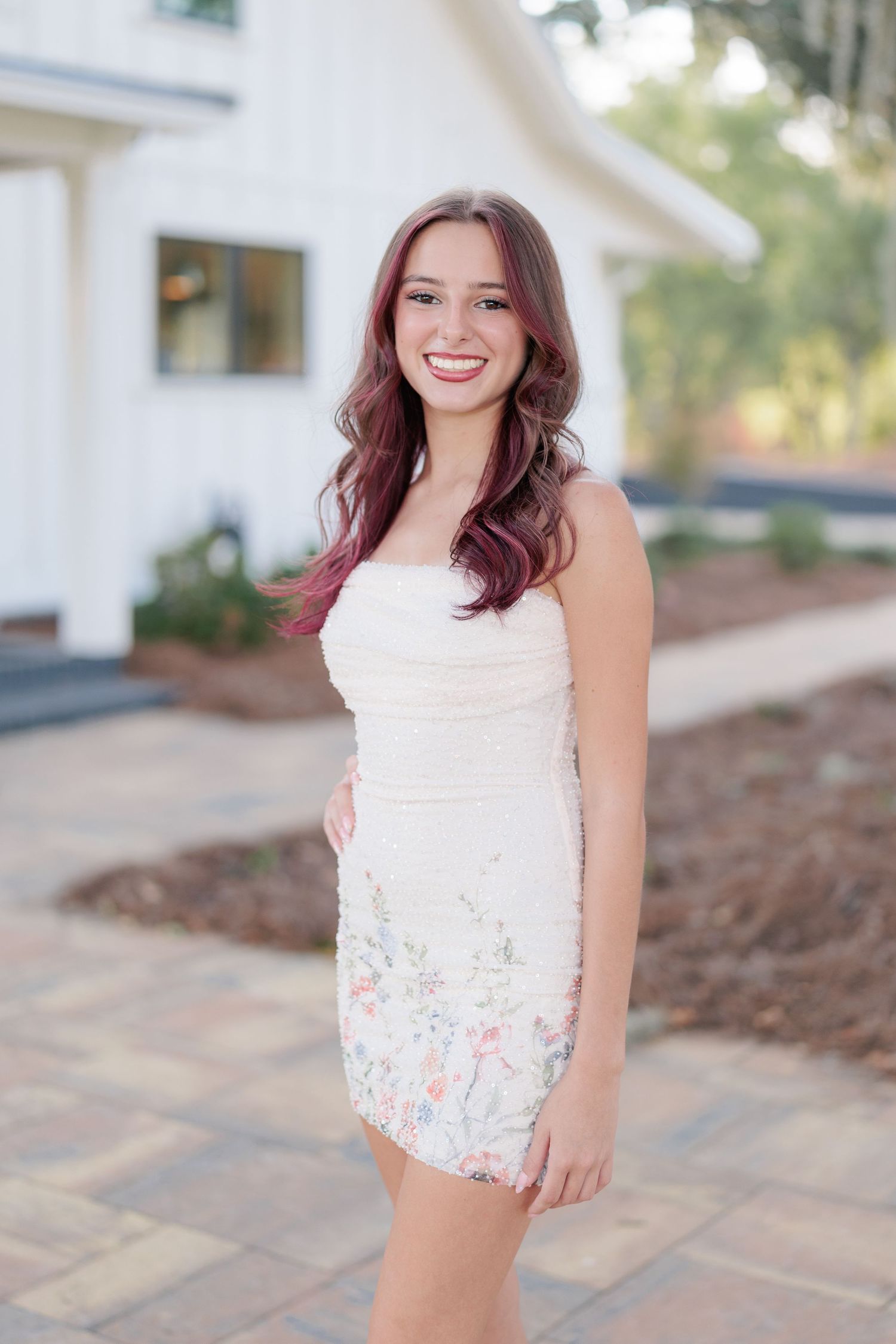 Beautiful portrait of a high school girl in her elegant prom dress, taken in Valdosta, South Georgia before the big dance.