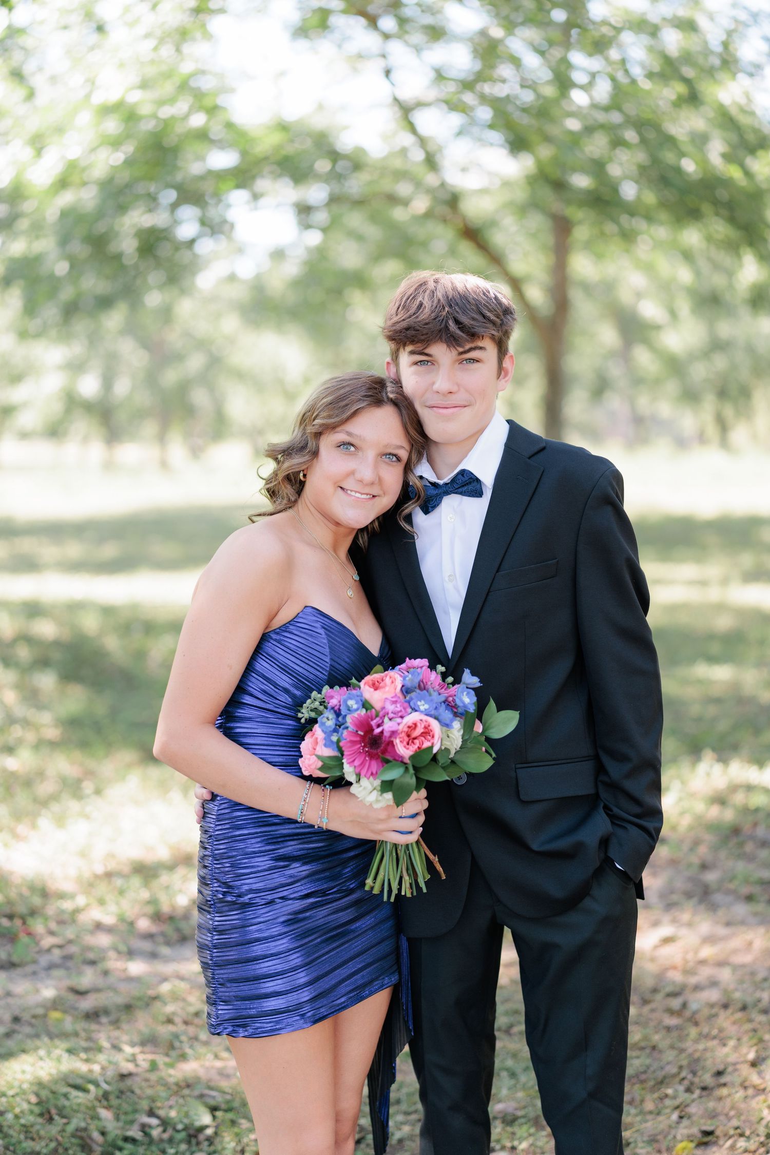 Elegant prom couple portrait of high school students dressed up in formalwear before the dance in Valdosta, Georgia.