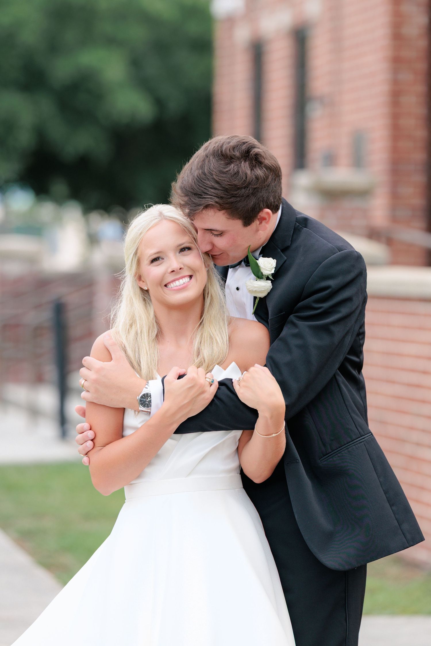 Couple enjoying themselves before entering their wedding reception in Waycross, Georgia. Taken by a photographer based in Valdosta, Georgia.