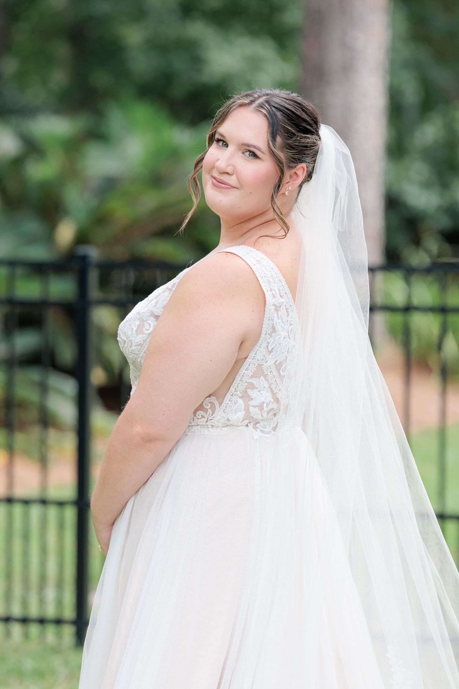 Elegant bridal portrait highlighting the lace details of the wedding dress at a beautiful Valdosta, Georgia backyard wedding.