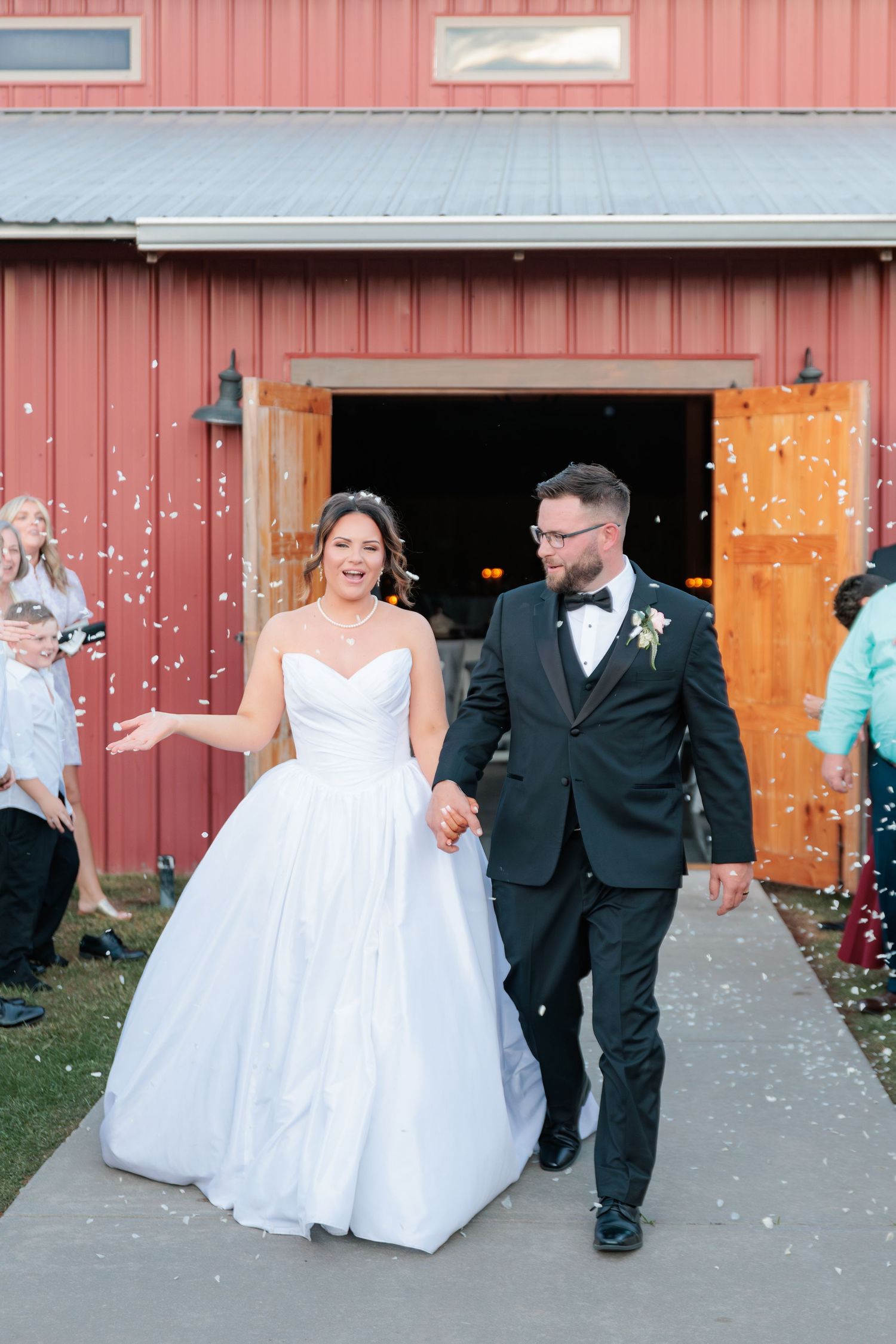 Candid portrait of a bride and groom making their grand exit from the reception from their wedding in South Georgia.