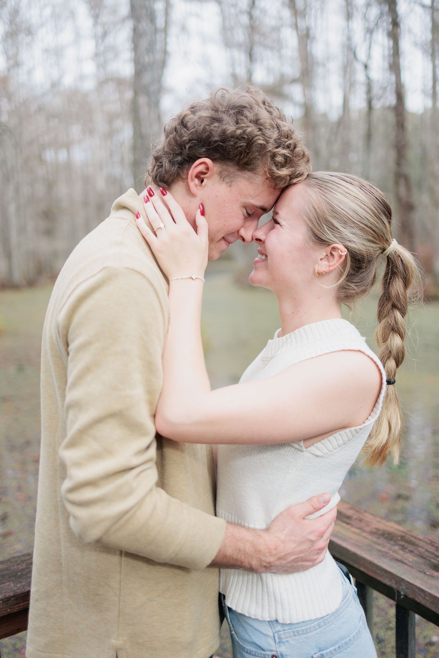 Authentic, joyful engagement portrait of a couple laughing together during an engagement session with photographer based in Valdosta, GA.