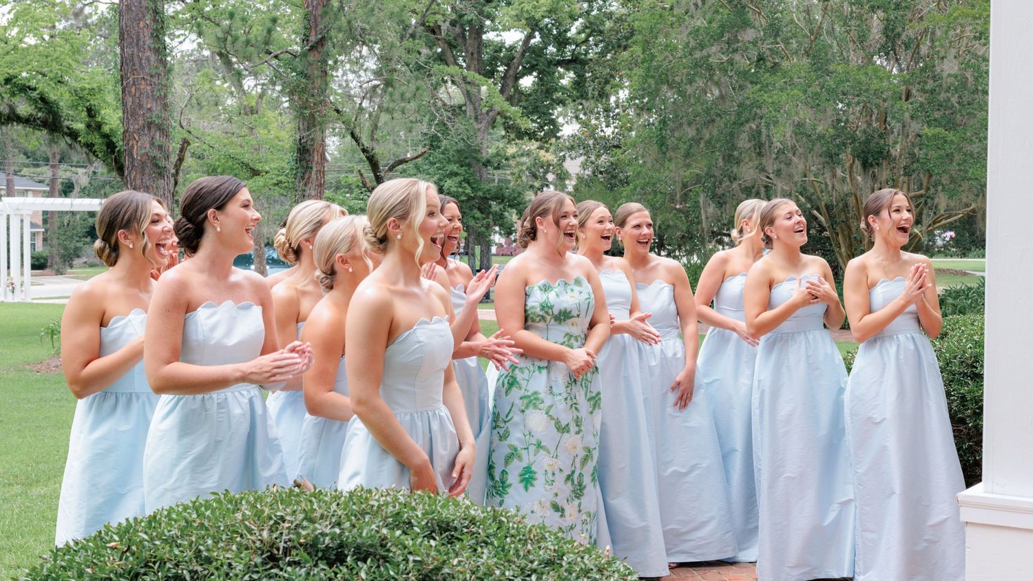 Bridal party seeing the bride in her dress for the first time after the bridal party gets ready for the ceremony in Waycross, Georgia.