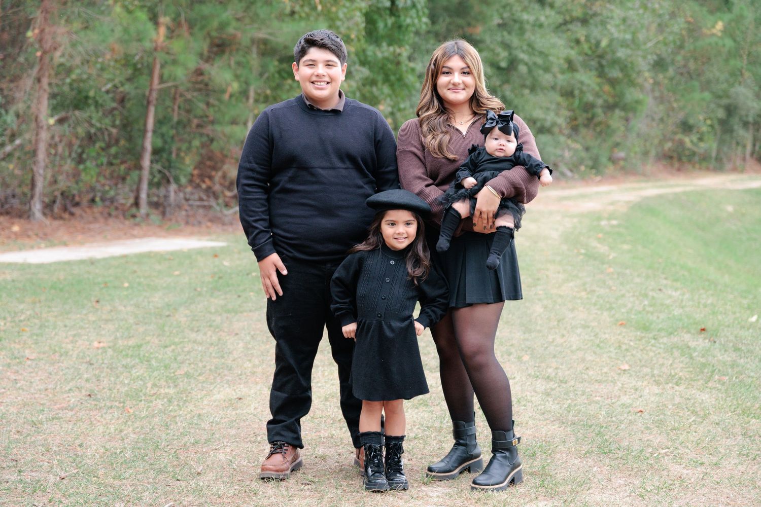 Candid, natural family portrait session featuring children laughing together outdoors in South Georgia.