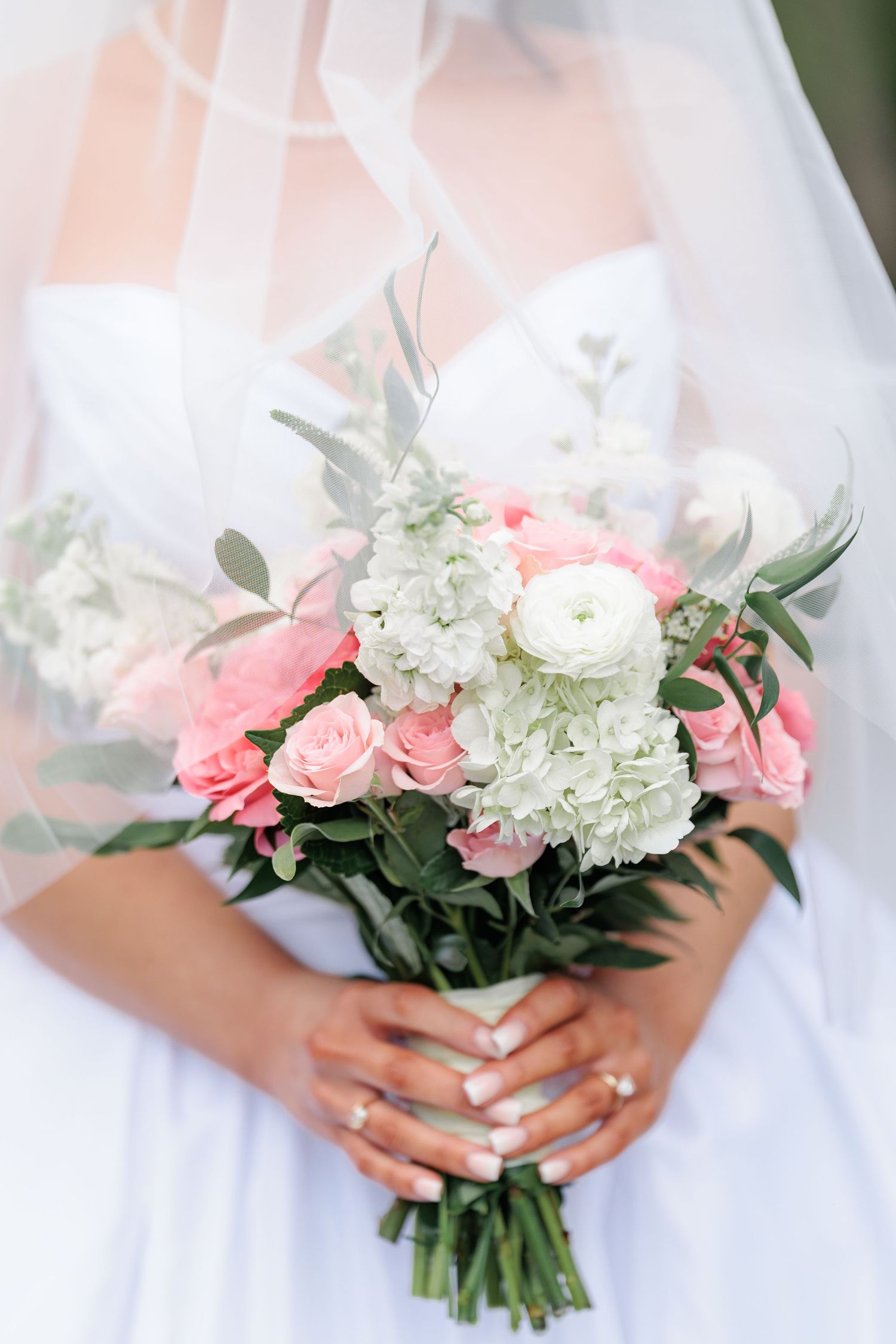 Elegant bridal portrait highlighting the bouquet of flowers arranged for the bride on her wedding day in South Georgia.