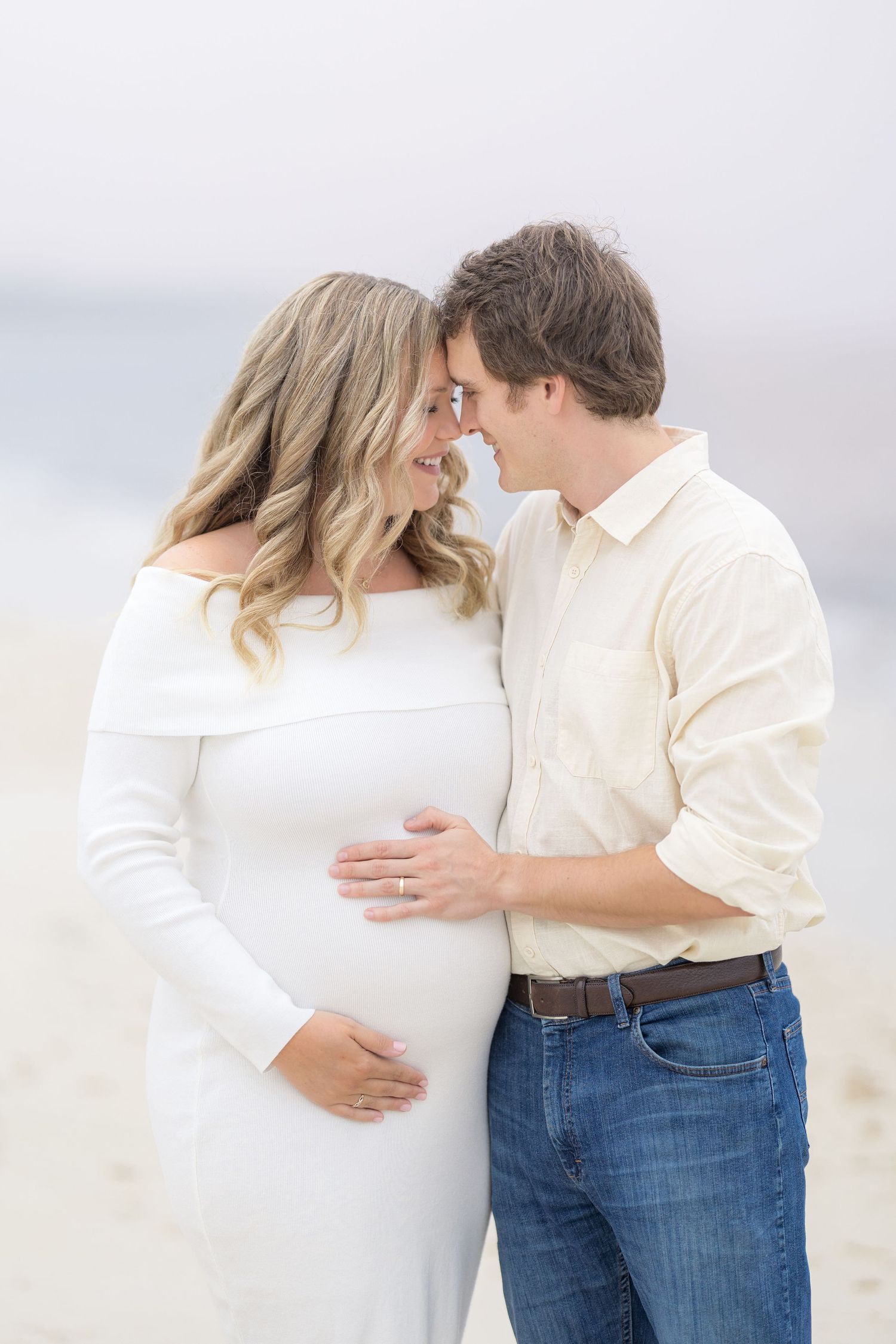 Image of couple celebrating their maternity journey and looking forward to meeting their little one with a photographer in South Georgia.