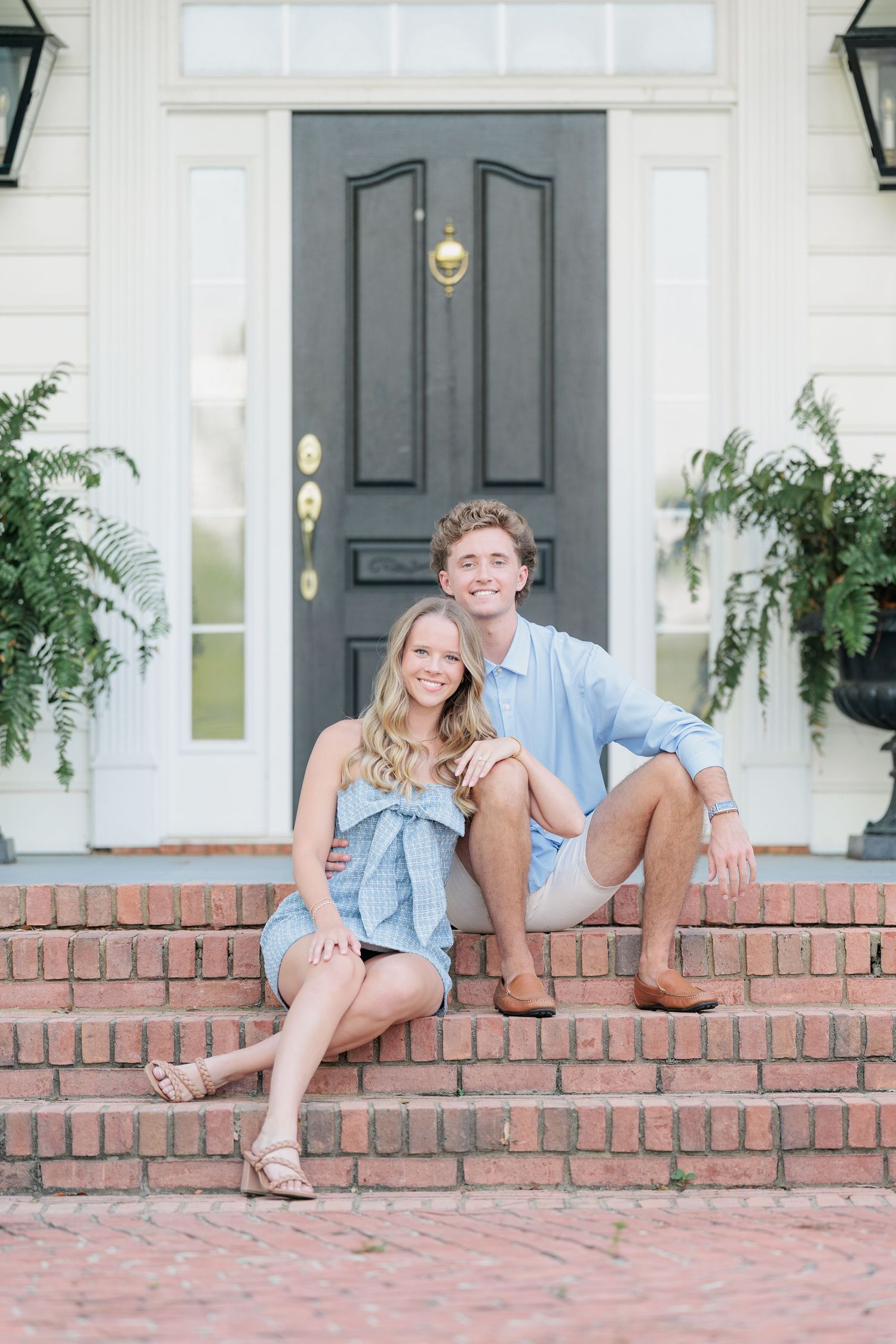 Authentic, joyful engagement portrait of a couple laughing together taken by a photographer based in South Georgia.