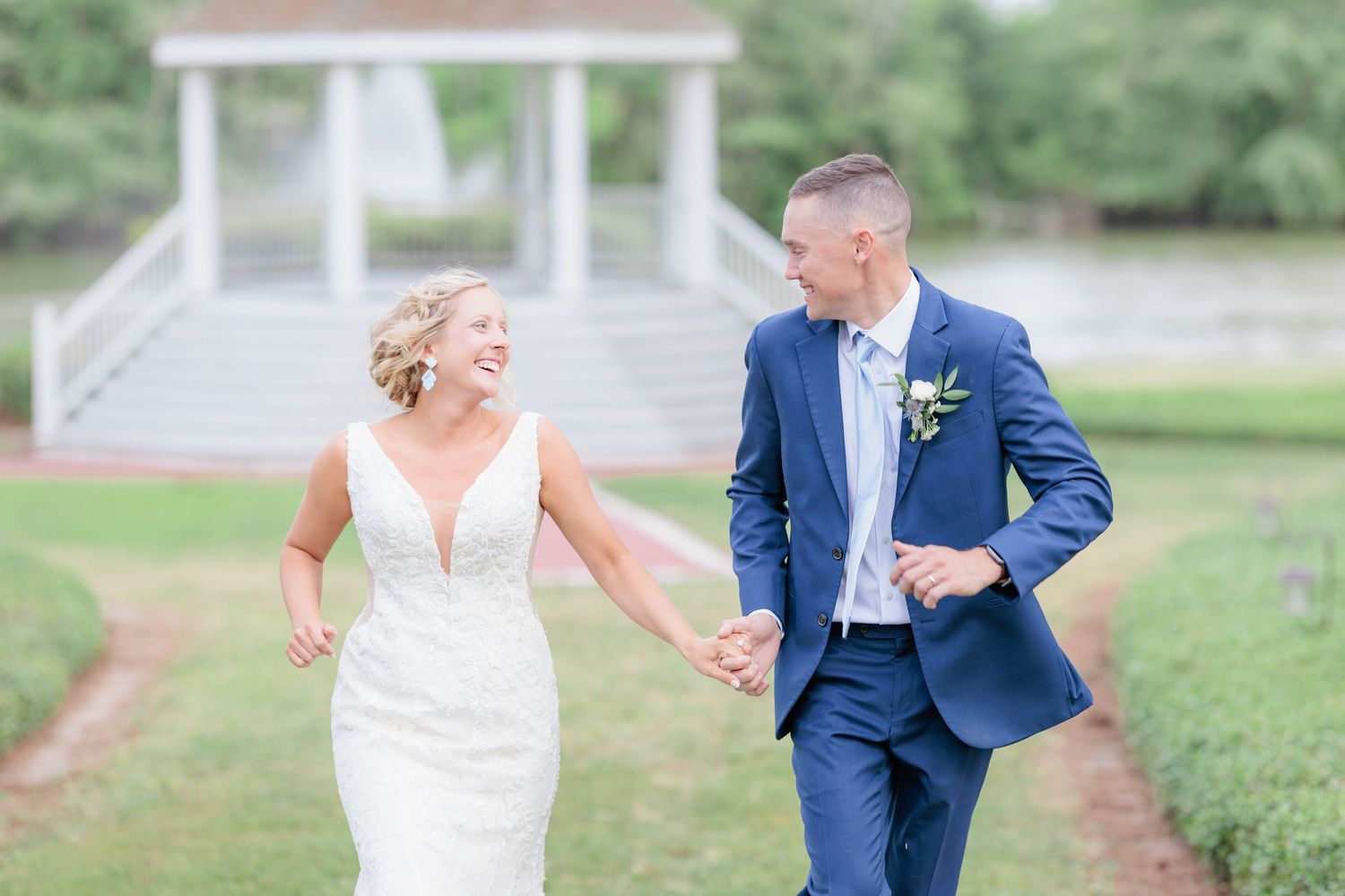 Candid portrait of a bride and groom embracing during a romantic sunset session by a wedding photographer in South Georgia.