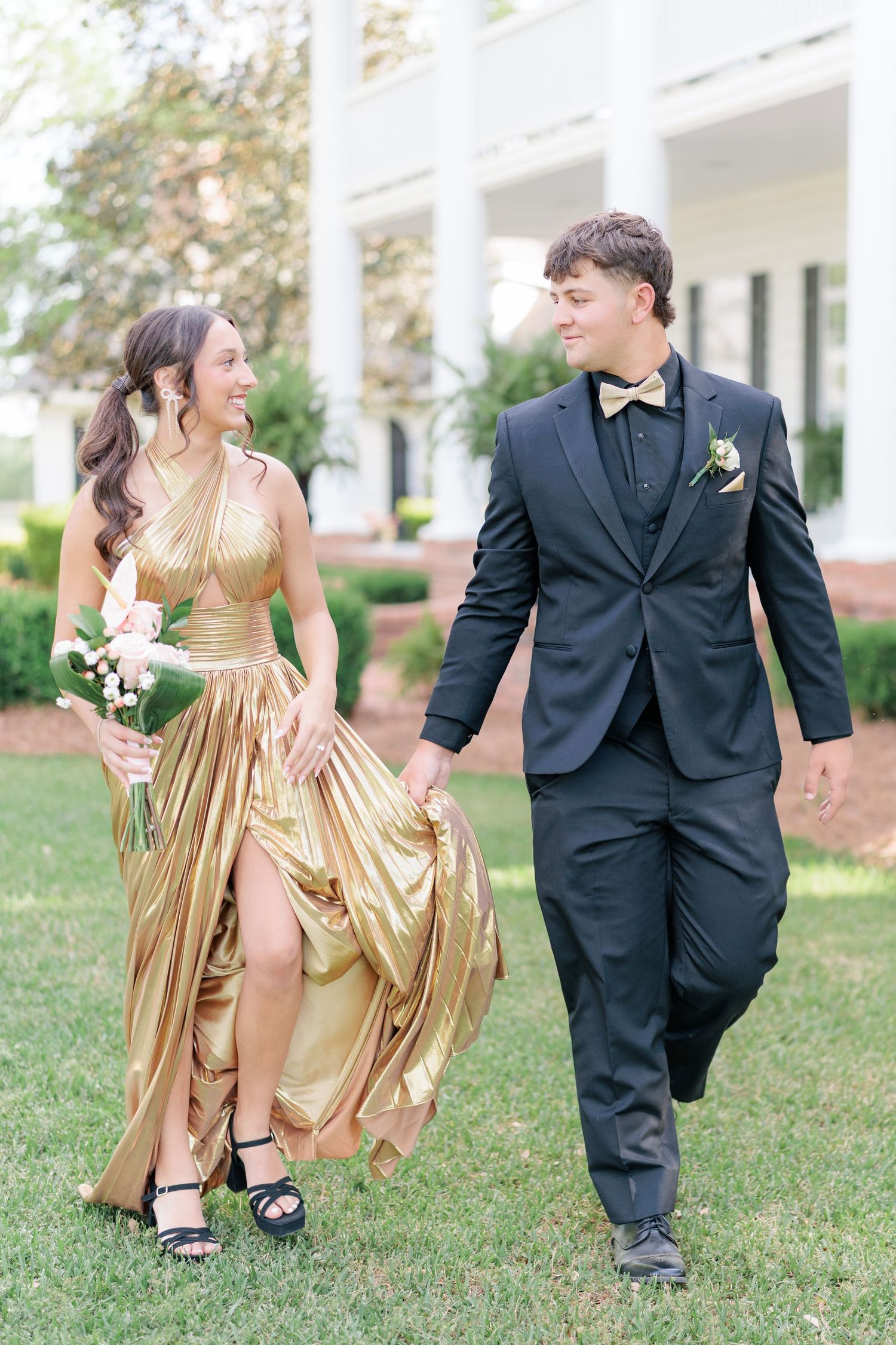 Elegant prom couple portrait of high school students dressed up in formalwear before the dance by a photographer based in Valdosta, GA.
