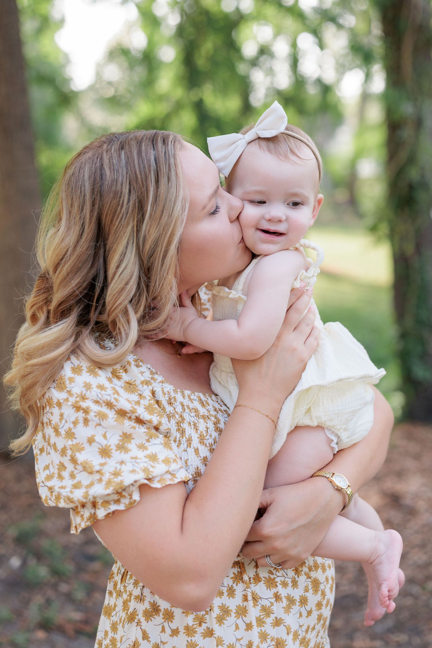 Candid, natural family portrait session featuring parents and children laughing together outdoors in South Georgia.