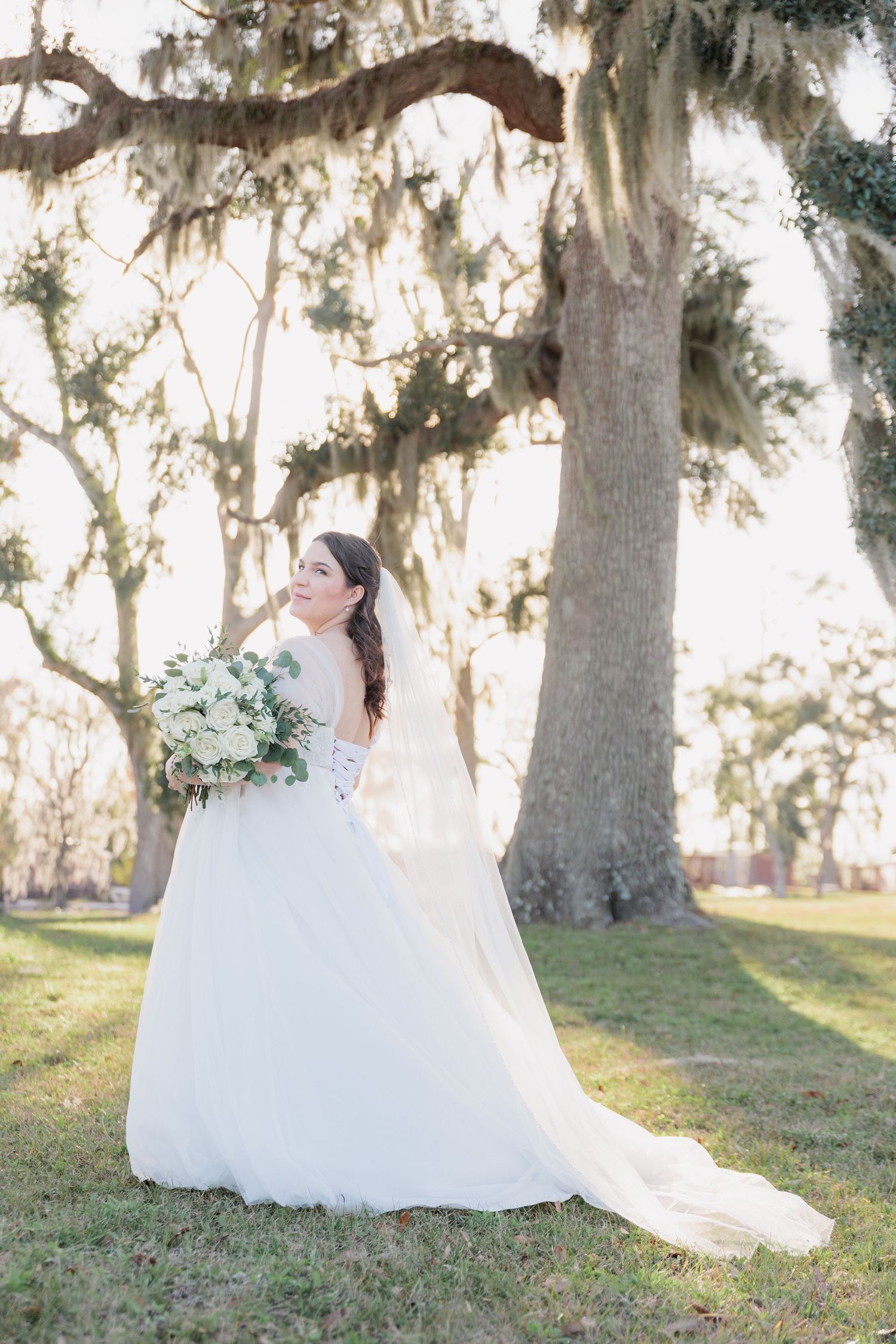 Elegant bridal portrait highlighting the lace details of the wedding dress at a beautiful wedding venue in South Georgia.