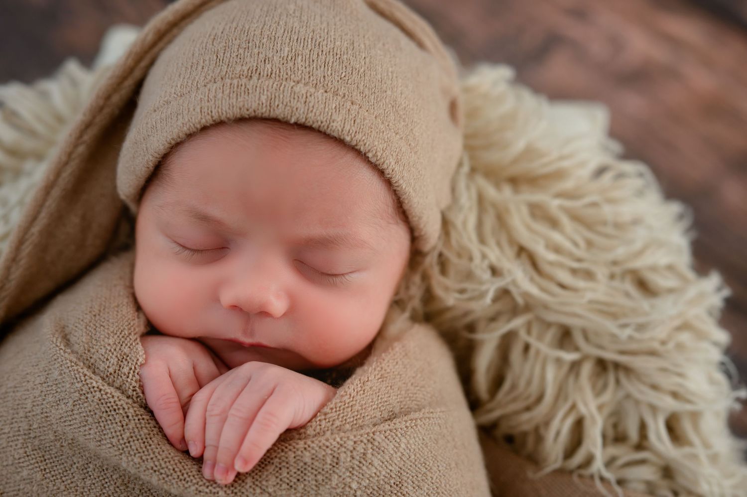 Sleeping wrapped newborn session in Katy Tx studio.