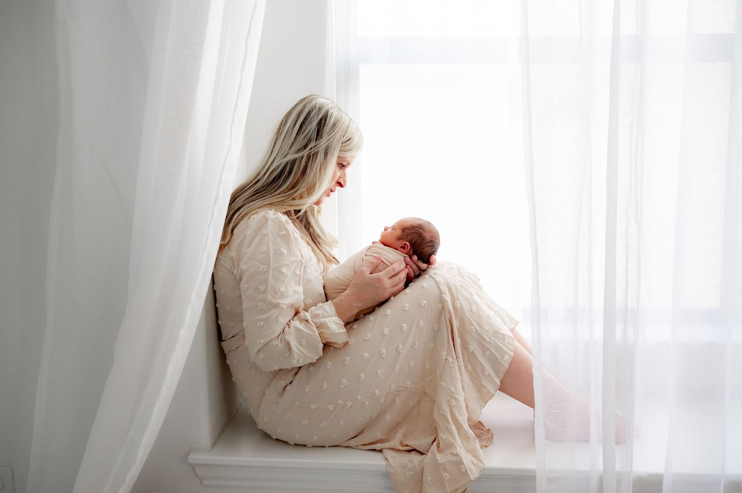 Sentimental mom and baby moment lifestyle newborn session