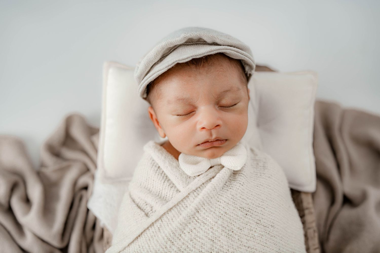 Newborn session with calm, wrapped sleeping baby in Houston Tx