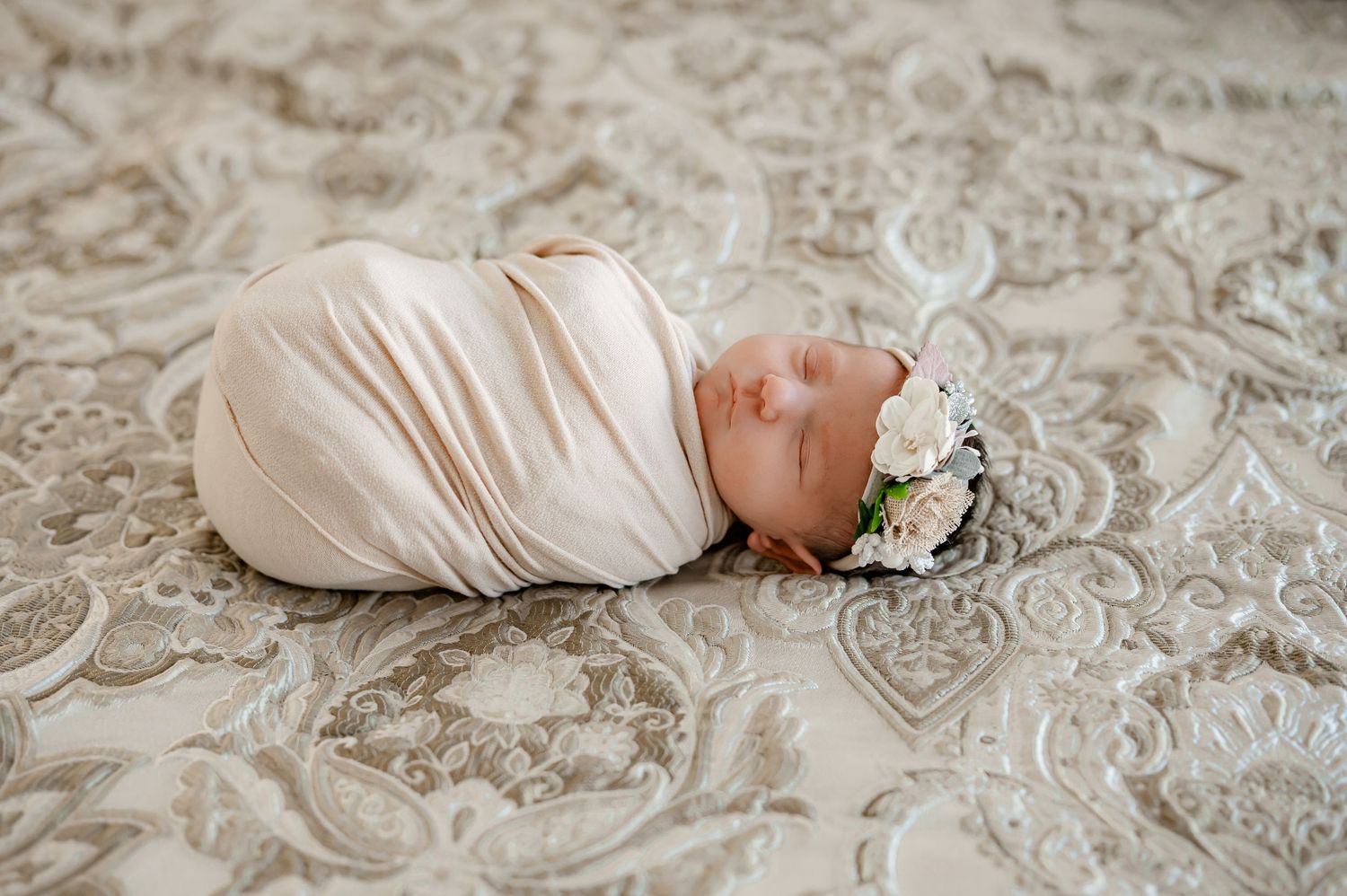 Wrapped newborn during Lifestyle Newborn session in Katy Texas